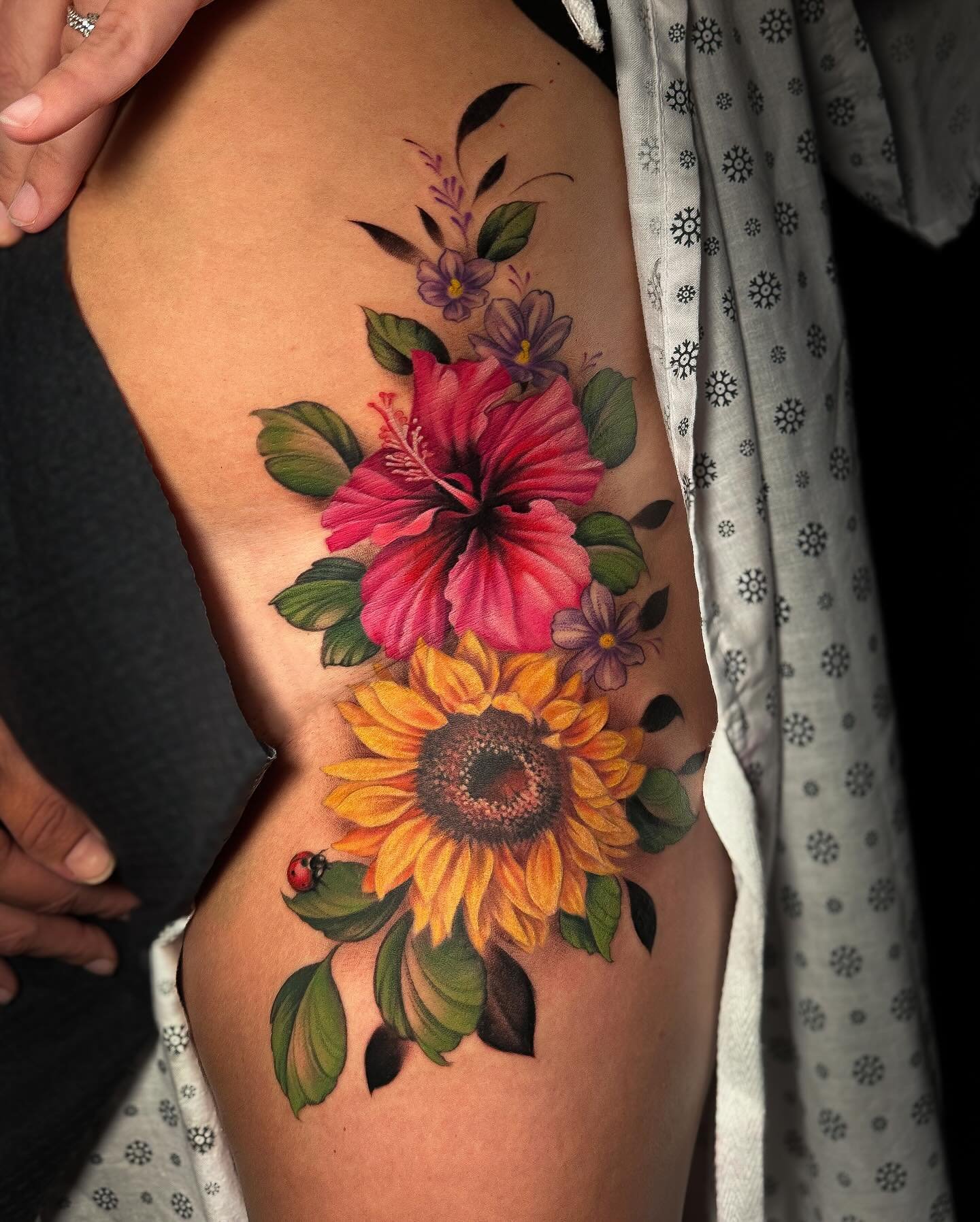LOVE how this floral piece is fitted to Amanda&rsquo;s hip so well. Small coverup hidden in the pink hibiscus. She had a couple of laser removal sessions done on it so that definitely allowed us to do the coverup with ease. Swipe for the before photo