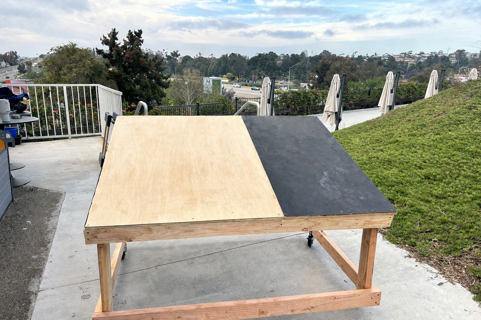 Rolling magic carpet platform for Aladdin Jr under construction, built from plywood, lumber, and caster wheels for school musical staging.