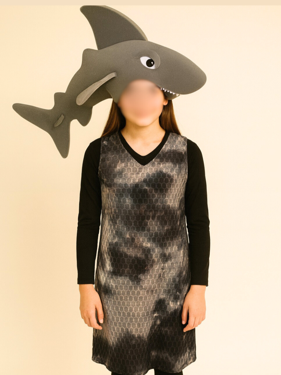 Shark costume for The Little Mermaid JR musical, featuring an Amazon-purchased foam shark headpiece paired with a simple gray tunic worn over black leggings and a black long-sleeve shirt for Ursula’s Lair ensemble scenes.