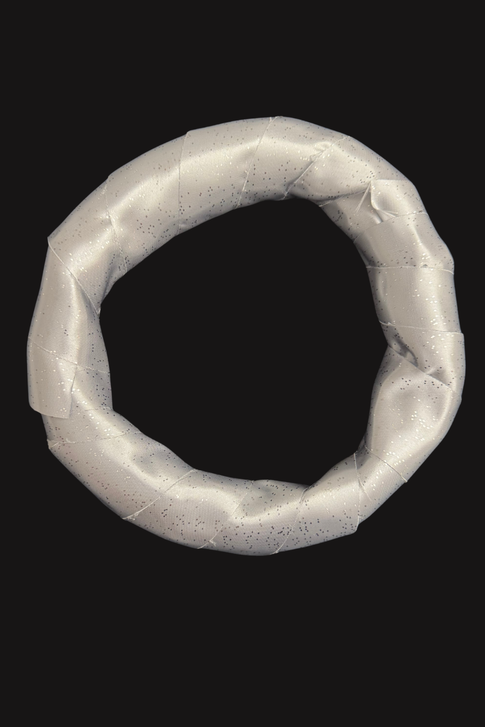 Silver sparkle ribbon was tightly wrapped around the padded ring to create a smooth finished surface.
