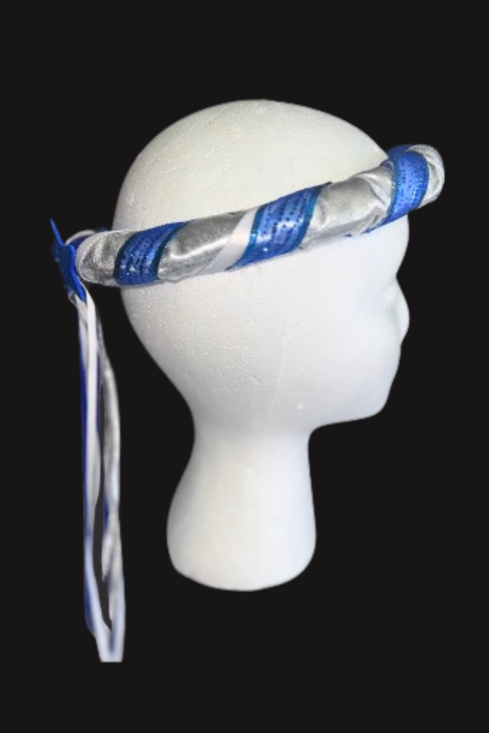 The completed genie halo was fitted on a mannequin head to check proportion, balance, and ribbon placement before performance use. ✨