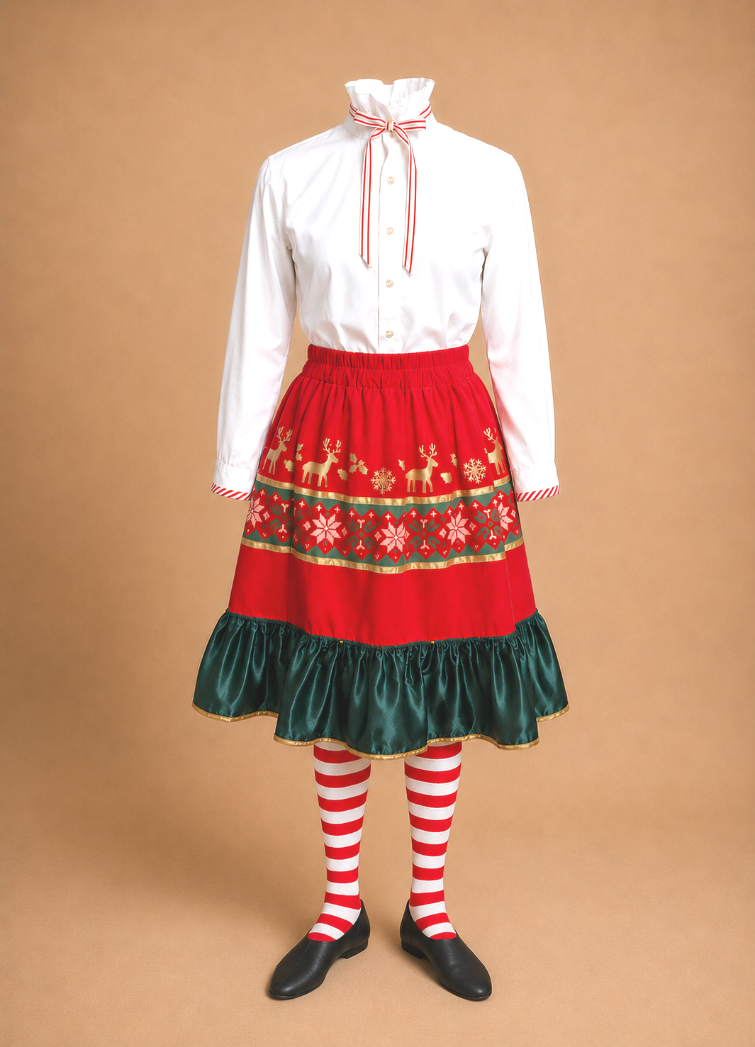 Elf Jr. the Musical costume featuring a white long-sleeve blouse and a red tiered skirt embroidered with reindeer and snowflake patterns, paired with red and white striped tights and black shoes. Old-world elf look  for school and communinity theater