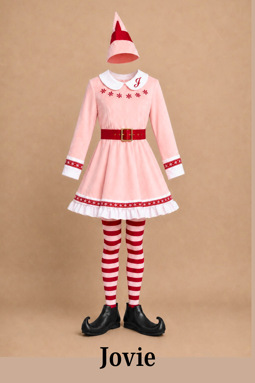 Jovie pink elf costume for Elf Jr. the Musical — pink dress with red and white holiday embroidery, red and white striped tights, black elf shoes, and elf hat. DIY costume guide at sewstylestage.com