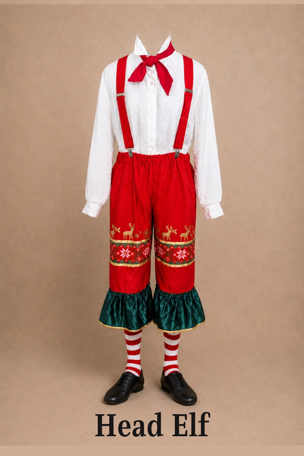A costume labeled 'Head Elf' featuring a white shirt with a red bow tie, red suspenders, red pants with Christmas-themed decorations, green ruffled pant cuffs, red and white striped socks, and black shoes. Elf the Musical costume