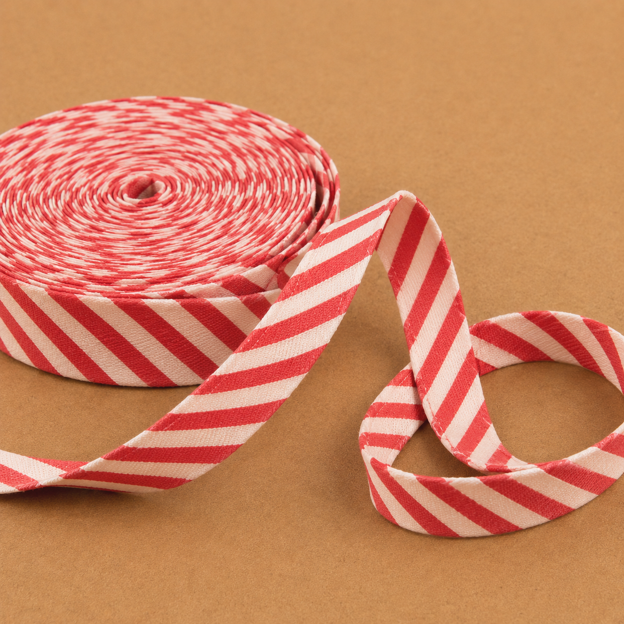 Red and white candy cane striped bias tape ribbon — used on elf vests sleeves and dresses for Elf Jr. the Musical. Essential trim for Old-World Santa's Workshop school theater costumes