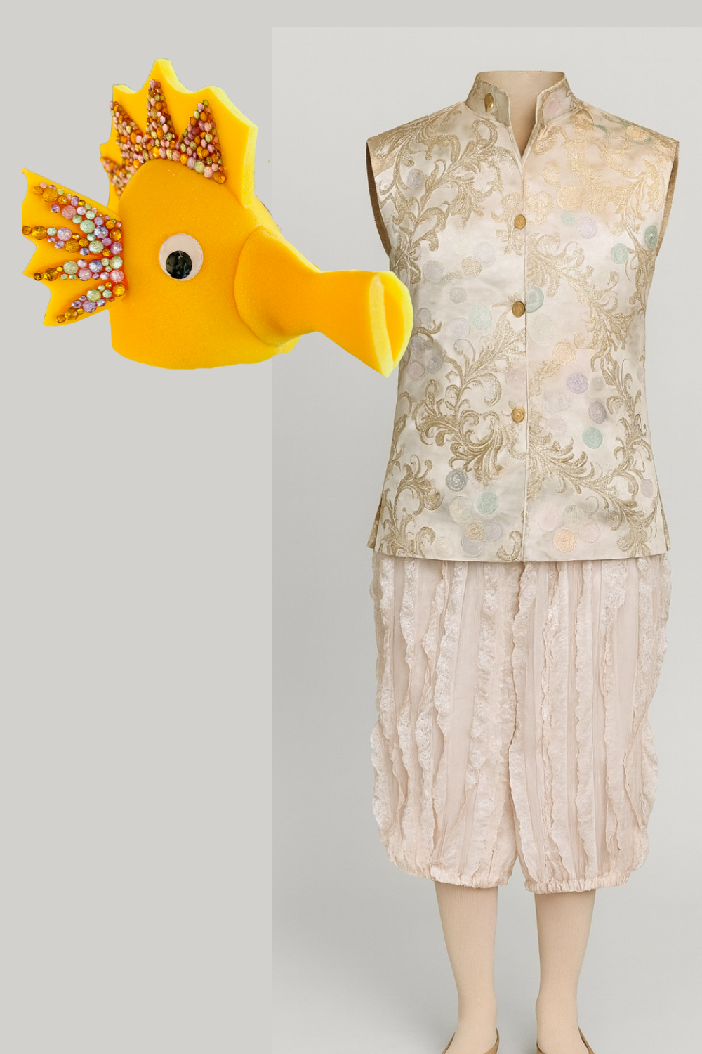 Volunteer-made seahorse costume for a youth theater production, created by upcycling a Chinese-style vest, sewing loose knickers for movement, and pairing with a bedazzled Amazon seahorse headpiece for a cohesive underwater look.