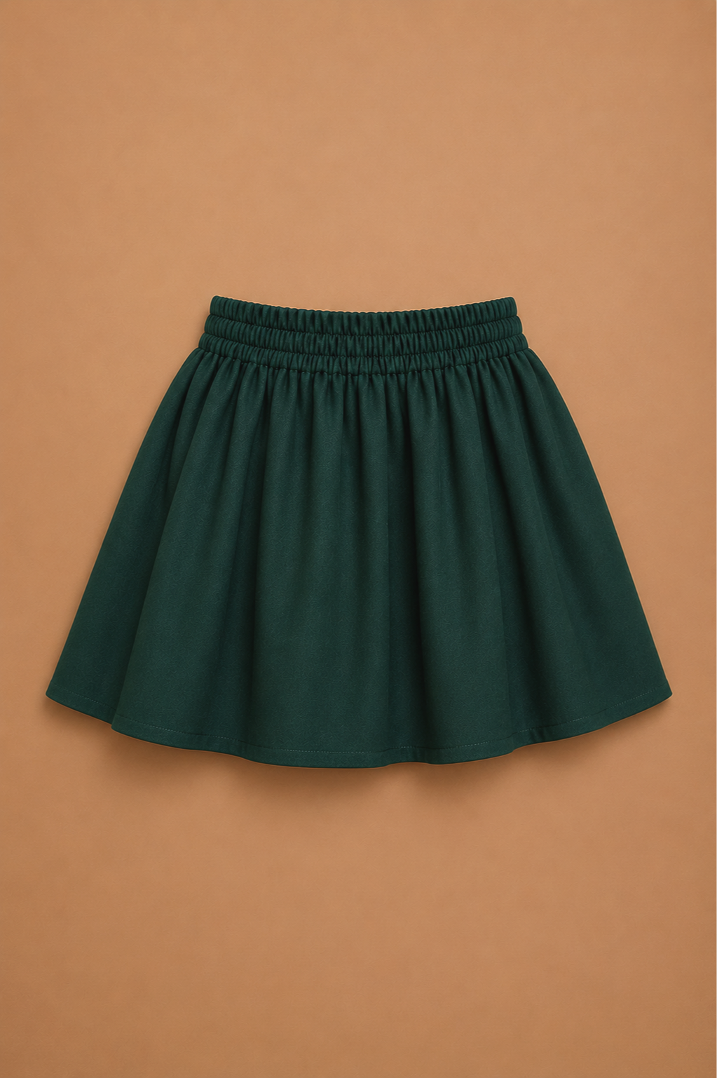 Dark green elastic waist circle skirt — versatile base piece for Elf Jr. the Musical workshop elf ensemble costumes. School theater production mix and match system