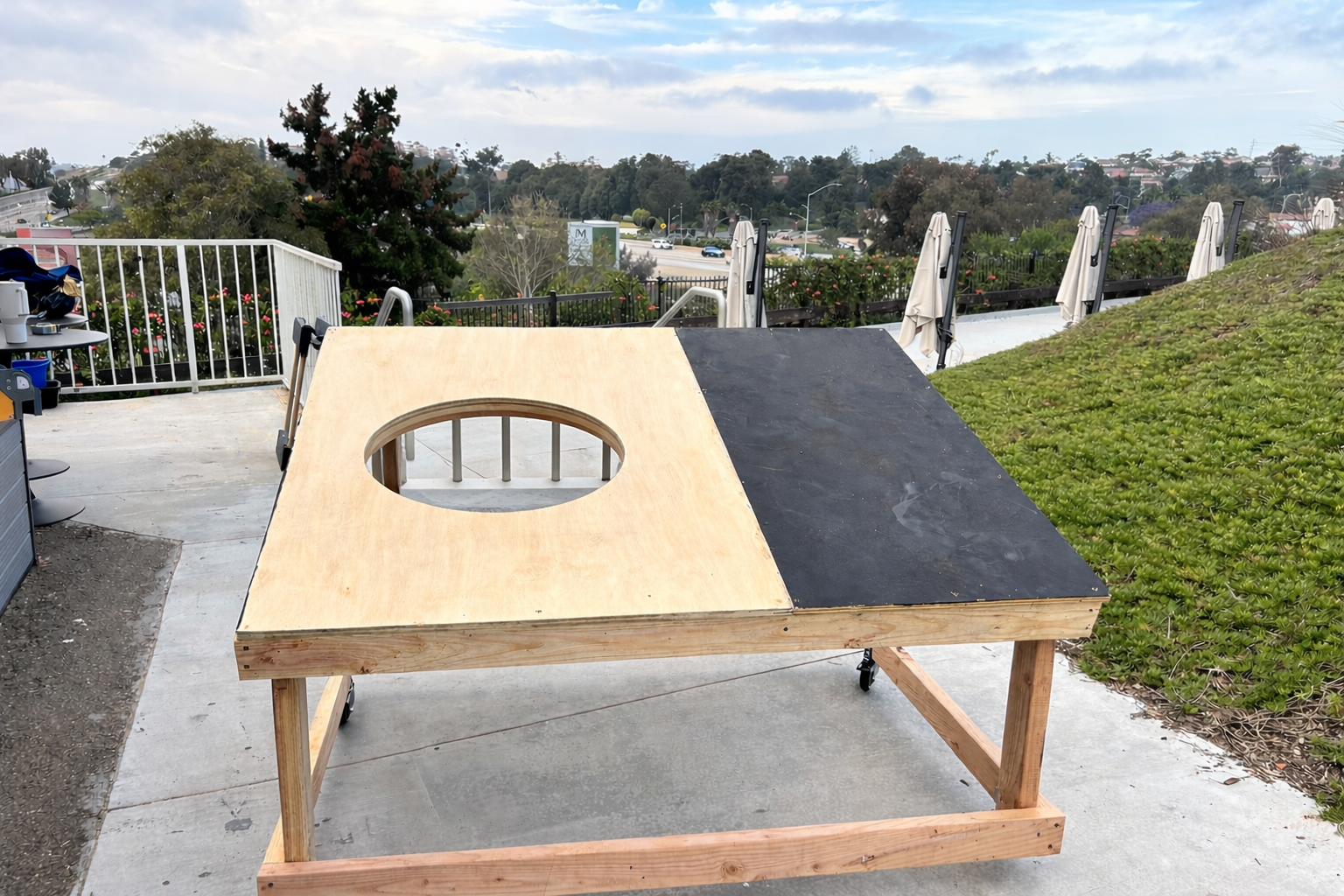 Rolling magic carpet platform for Aladdin Jr with center cutout for actor positioning during school musical construction.