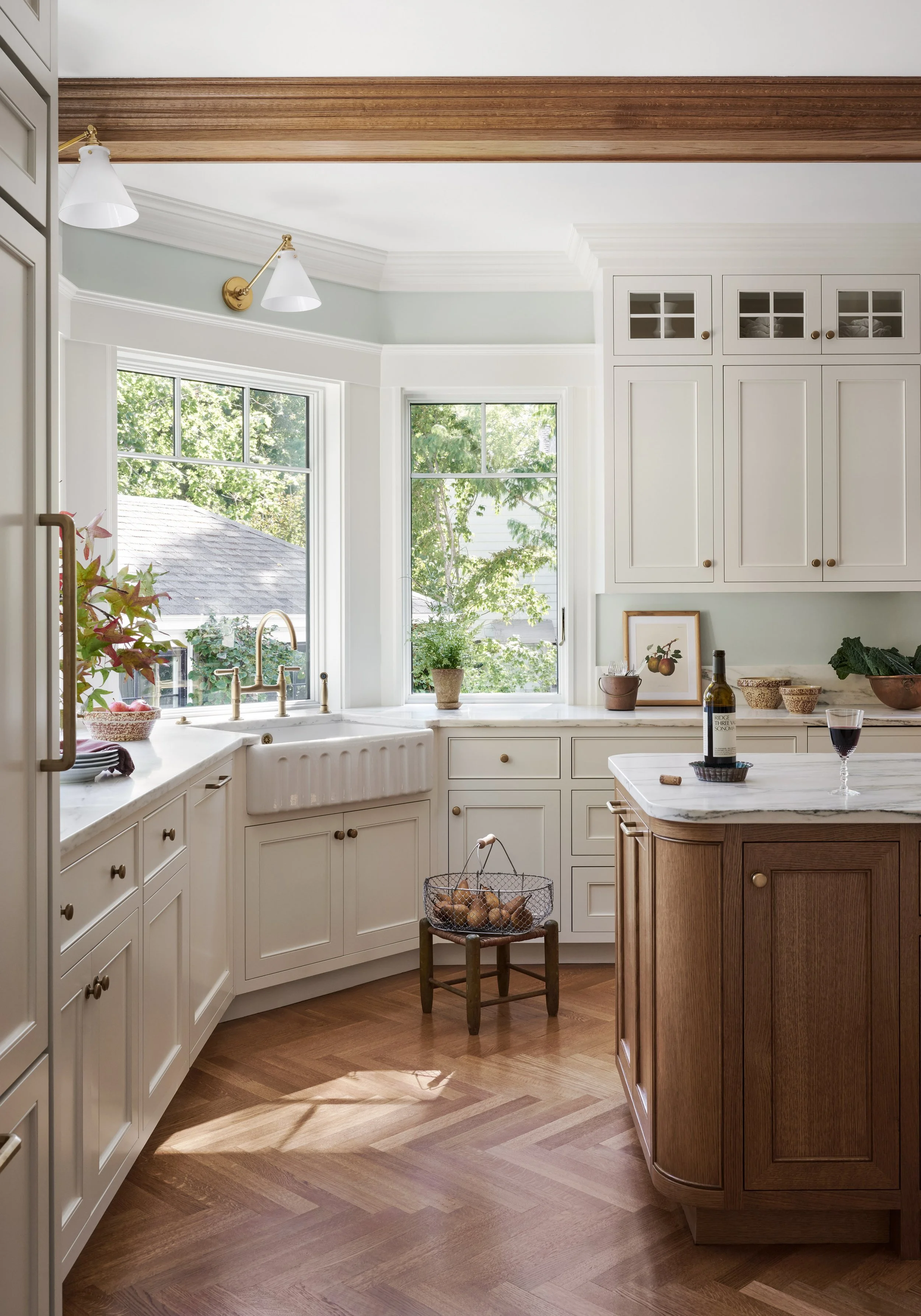Cream inset cabinets, farmhouse sink and curved oak island at Whitmore Road, Newburyport, designed by Ivory & Bone Interiors