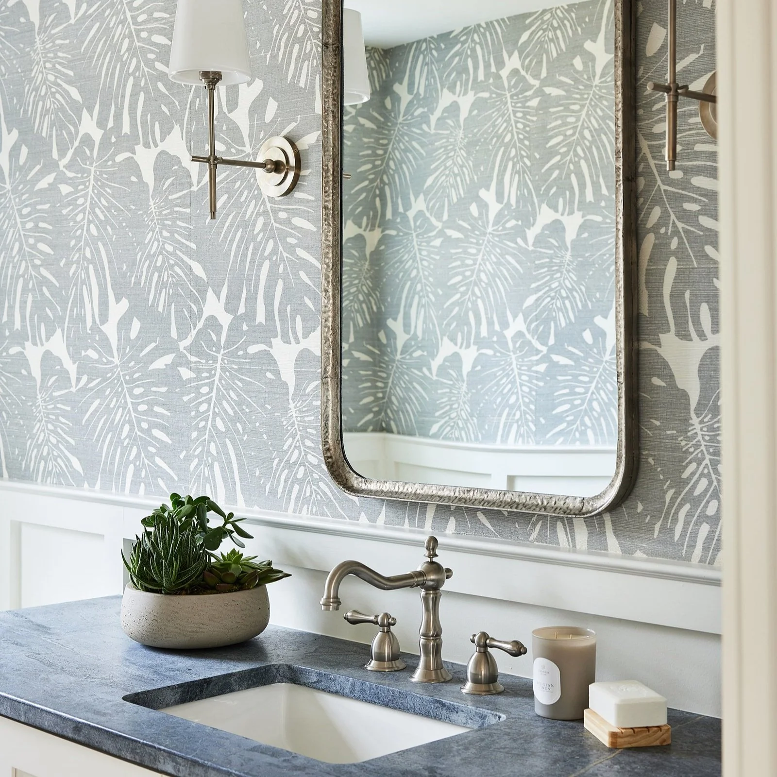 Powder room with botanical wallpaper, soapstone vanity and nickel faucet at Patriots Way, Rye, NH, designed by Ivory & Bone Interiors