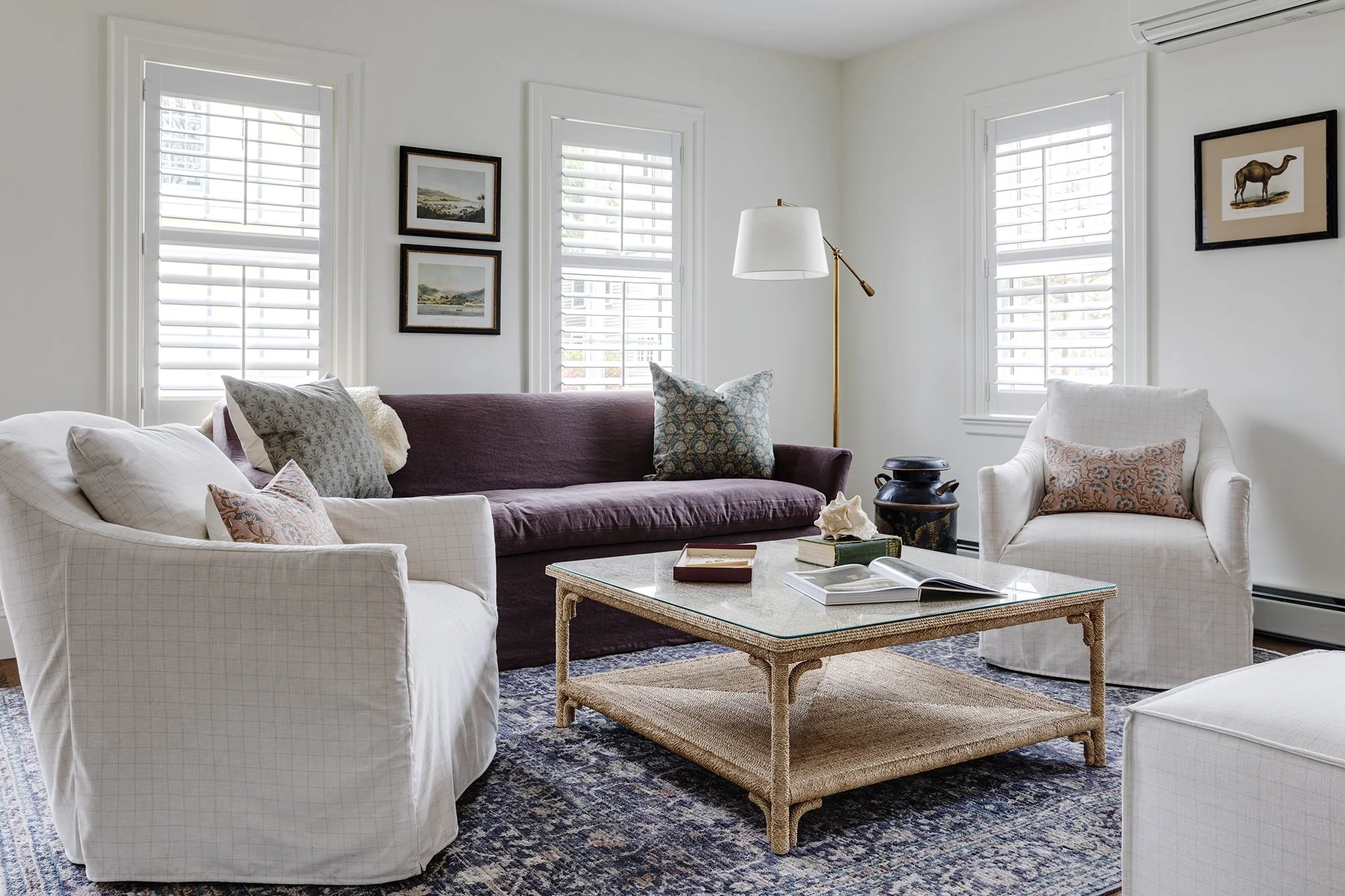 Living room with plum velvet sofa, white slipcovered chairs and plantation shutters at Salem Street, Newburyport, MA, designed by Ivory & Bone Interiors