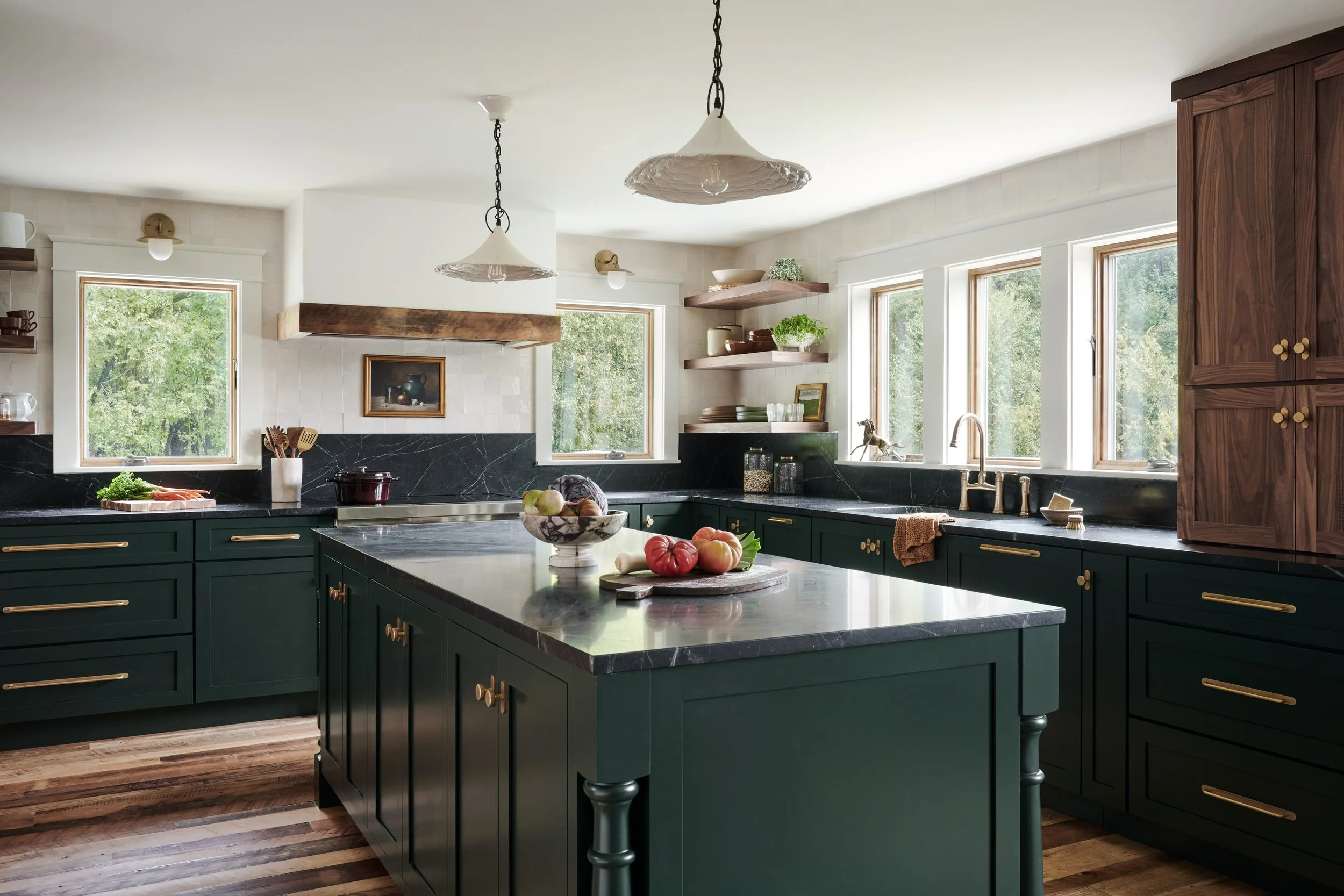 Open kitchen with forest green cabinetry, large island, wide-plank wood floors and walnut pantry cabinets by Ivory & Bone Interiors, Groveland, MA