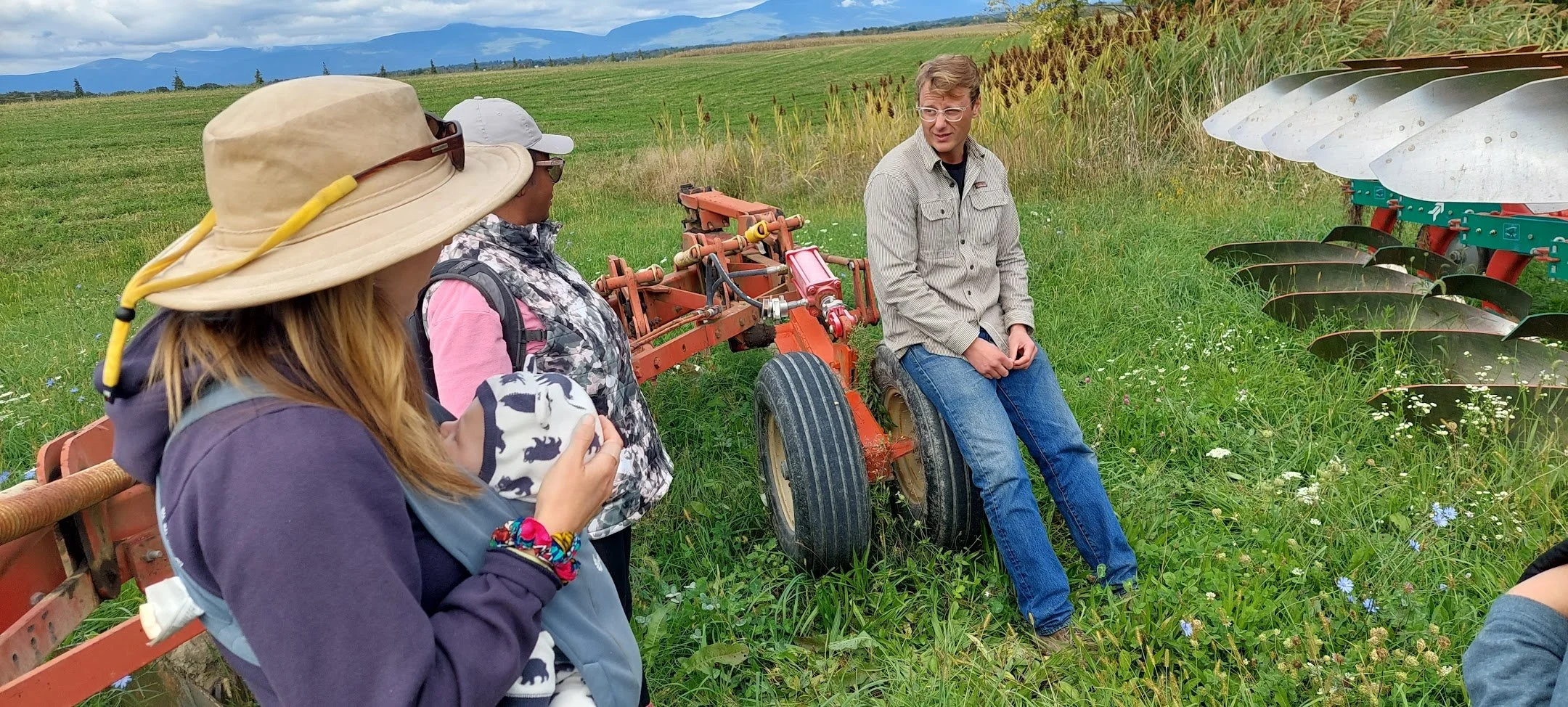 Jay on Wheel in field with laney and jamilla.jpg
