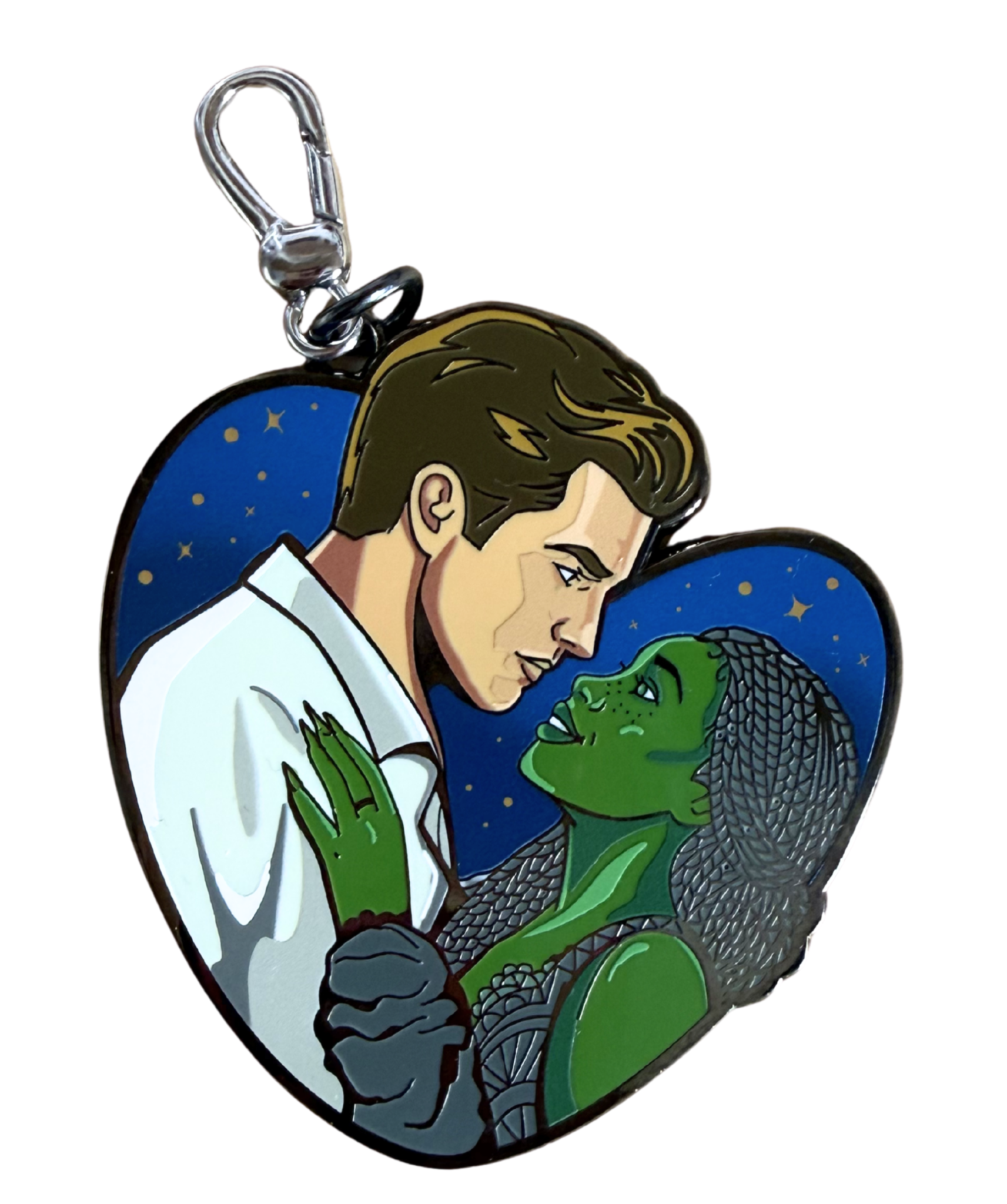 Illustration of a man and a green-skinned woman with scales on her face, gazing into each other's eyes, with a starry night background.