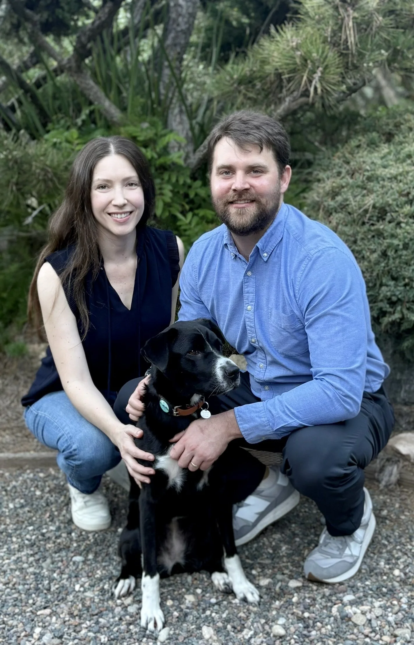 psychologists, rob & michelle lyons are squatting down next to their dog