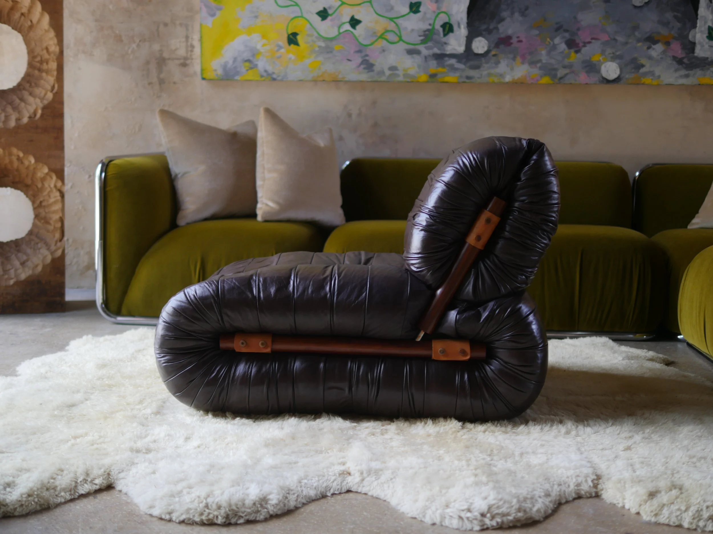 1970s Percival Lafer MP-115 lounge chair in rich brown leather, photographed inside the Casa de Barcelona showroom in Miami.