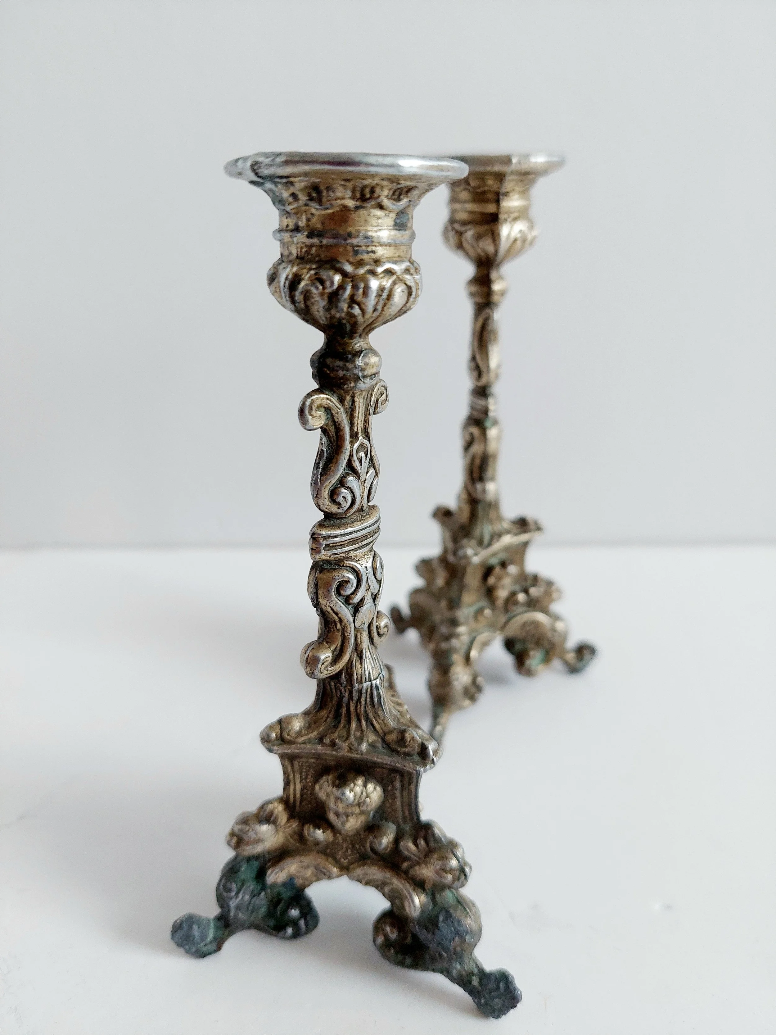A pair of vintage ornate brass taper candlestick holder