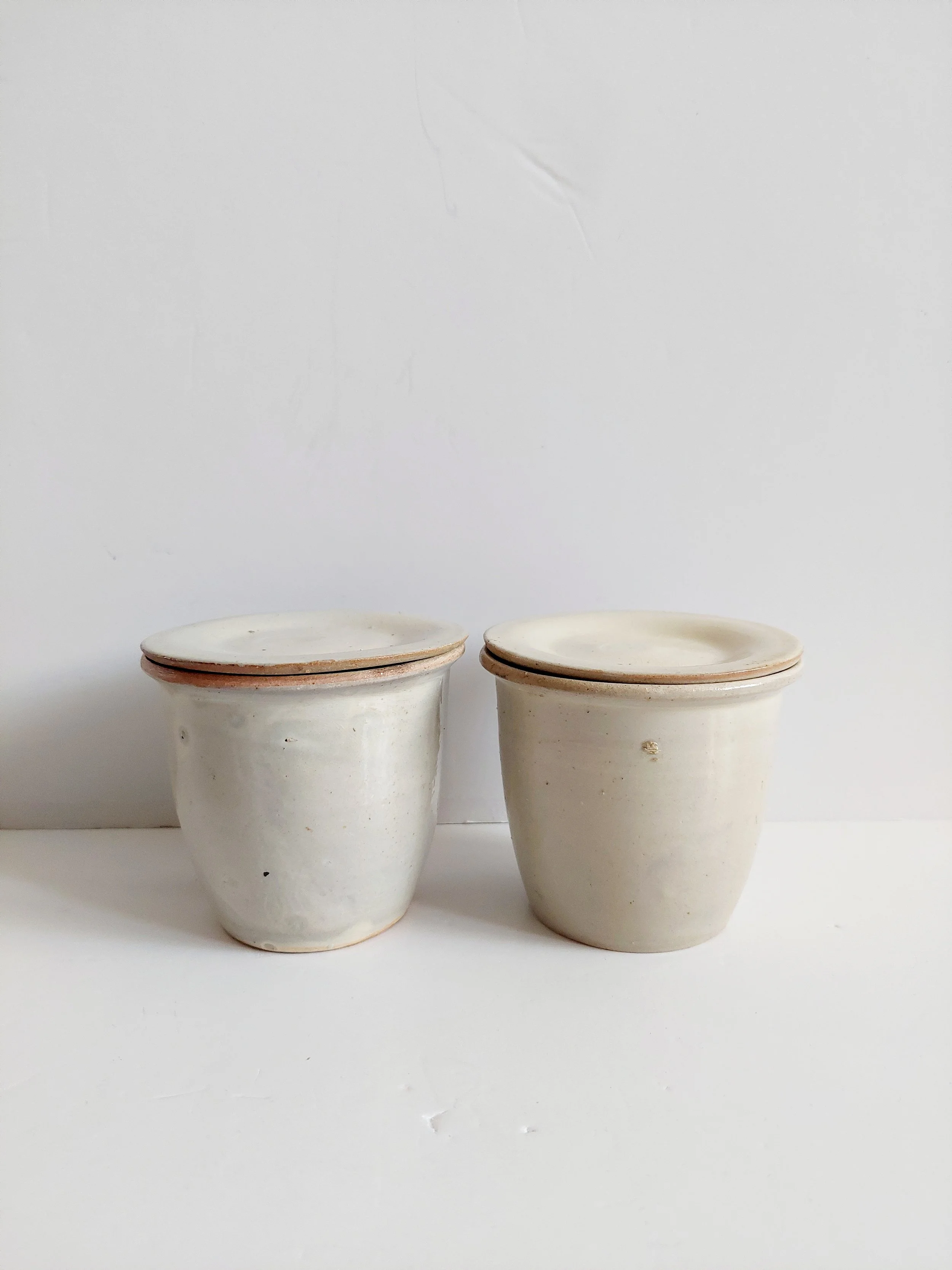 A pair of small stoneware confit pots (#511)