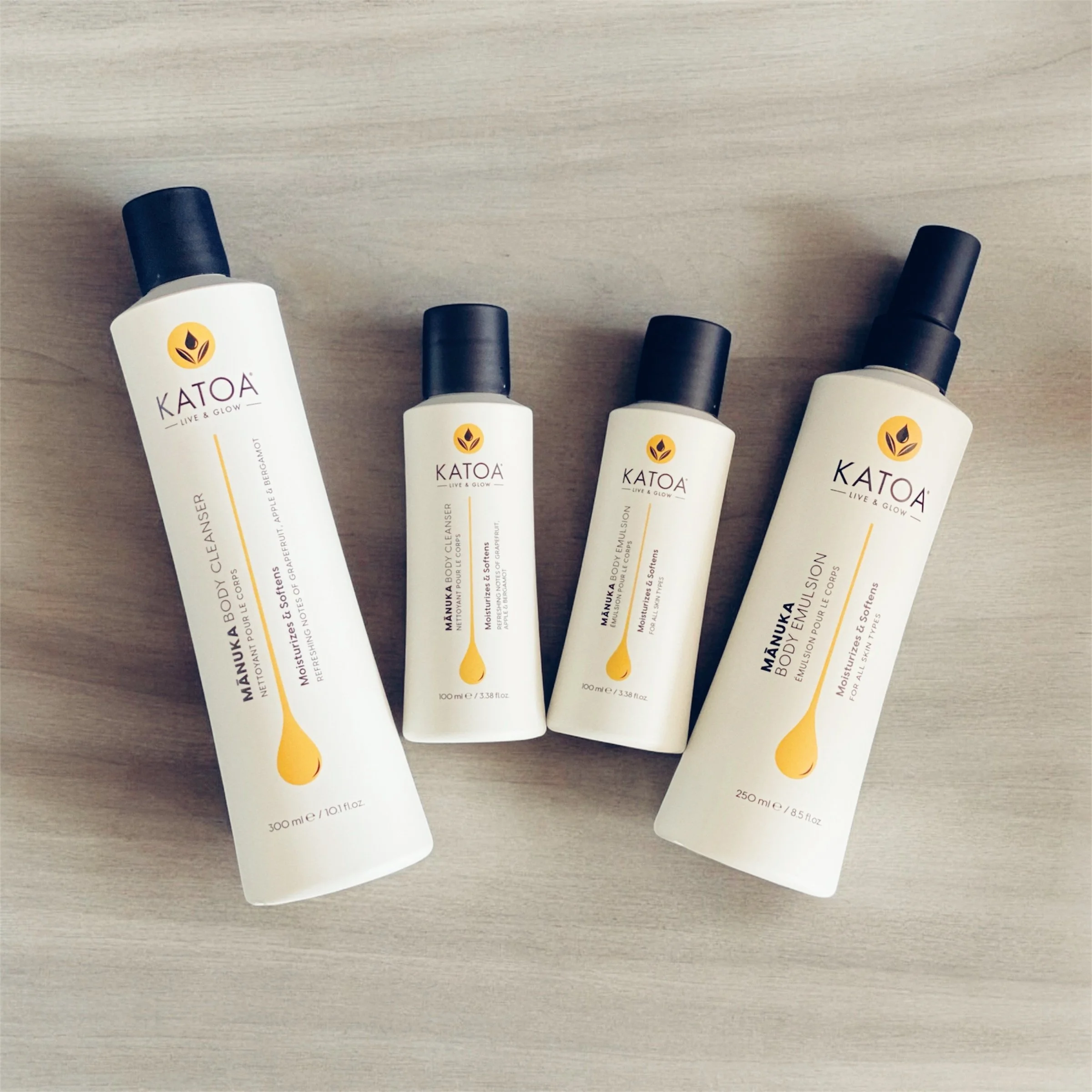 katoa body care product series lying on table