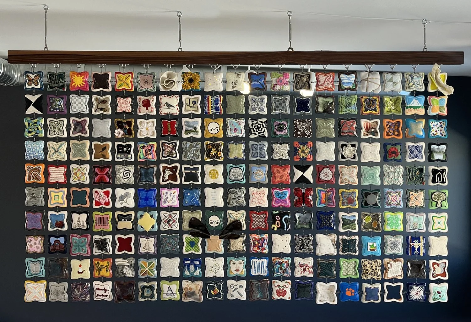 Dara Hartman | Charm (Community Quilt), 2025 | mixed media, porcelain, metal hooks | 48 x 72 in. | Please contact the gallery for pricing