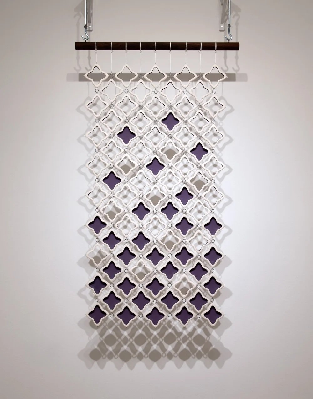Dara Hartman | Floating, 2025 | porcelain, metal, paracord, walnut | 55 x 32 x 1.5 in. | Please contact gallery for pricing.