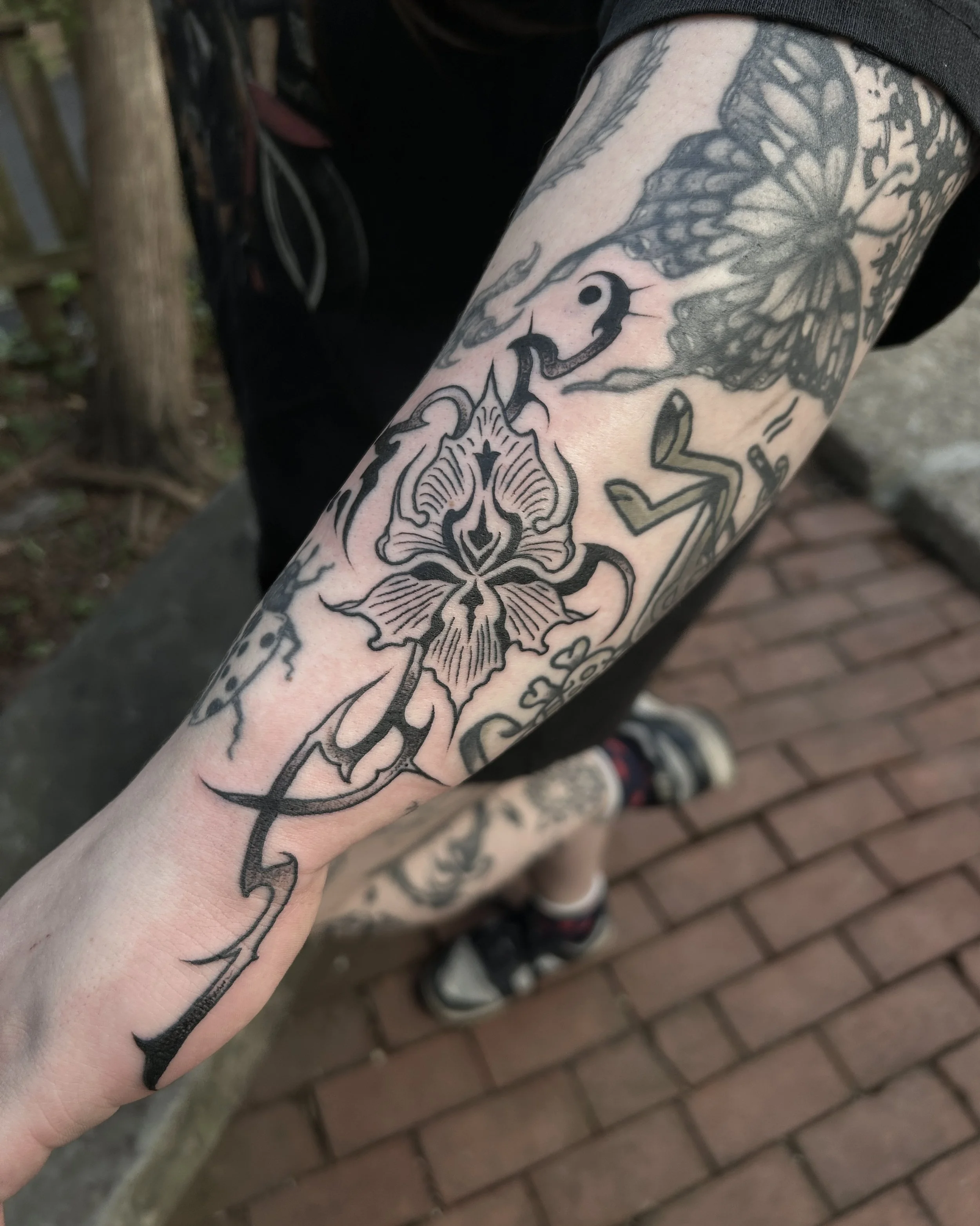 blackwork flower tattoo by James Mattox