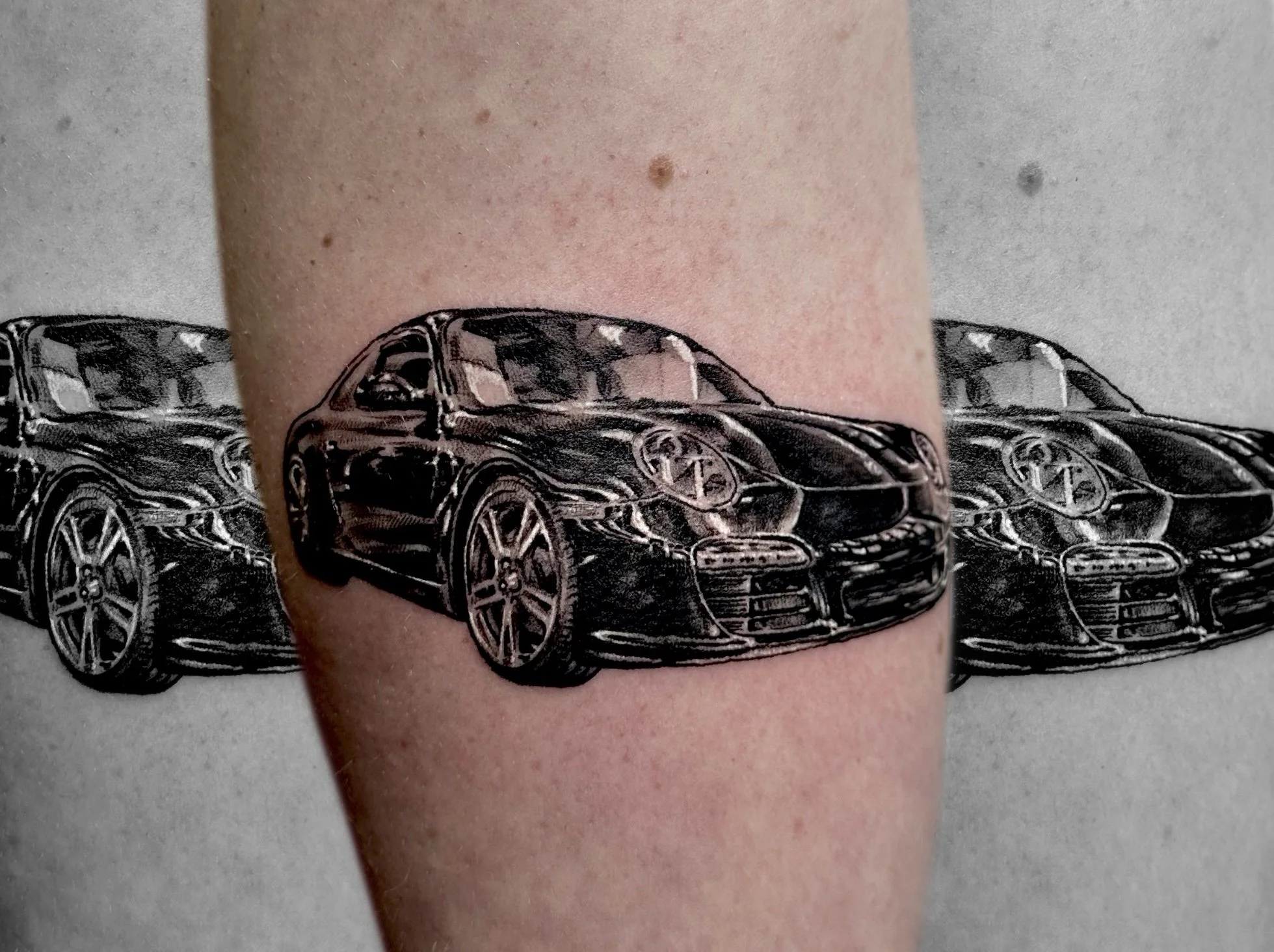 Porsche Black and Grey Realism Tattoo by Jeff Beck
