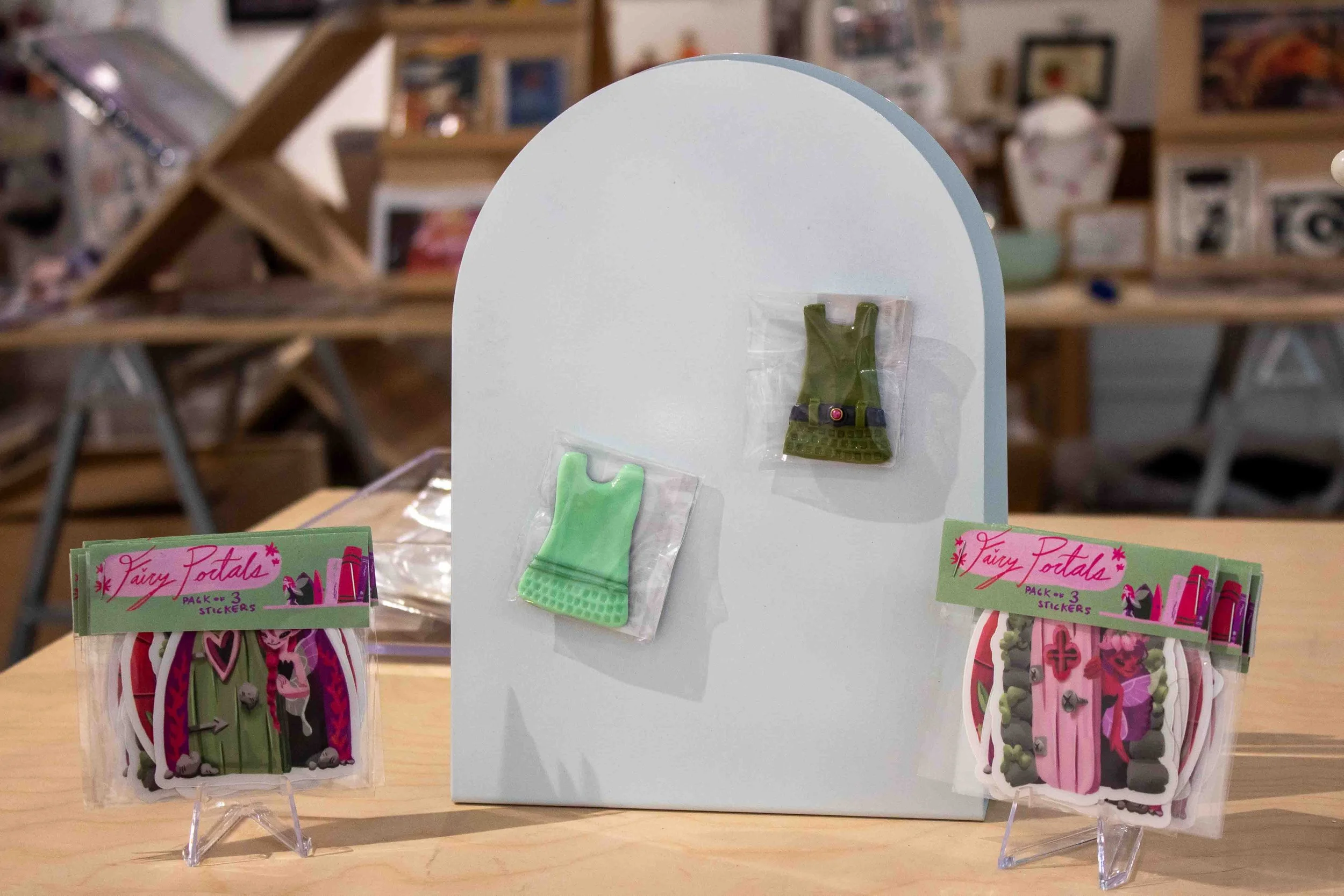 “Belted Shift Magnet” by Norah Clau is displayed on a magnetic board in the Shop Columbia display titled “MINI MINI: A Showcase of Miniature Works” during the artist reception on Thursday, Apr. 9, 2026. 