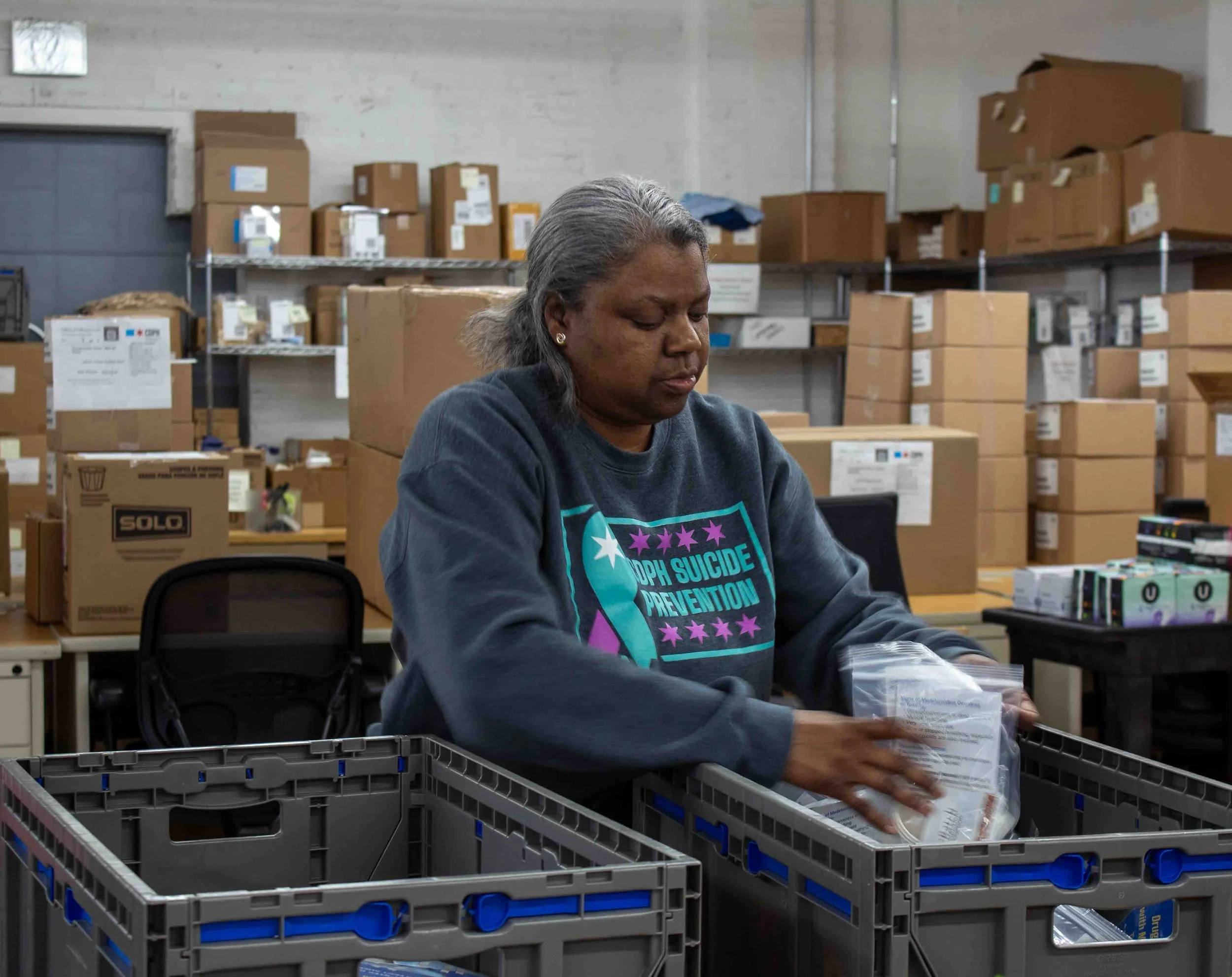 Patricia T. Johnson counts finished kits