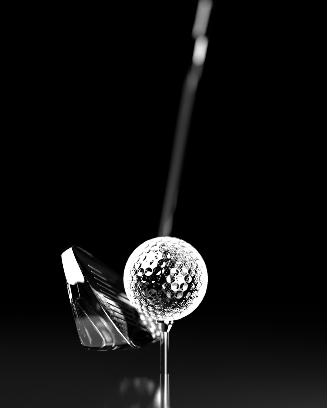 Close-up of a golf club head and a golf ball on a tee.