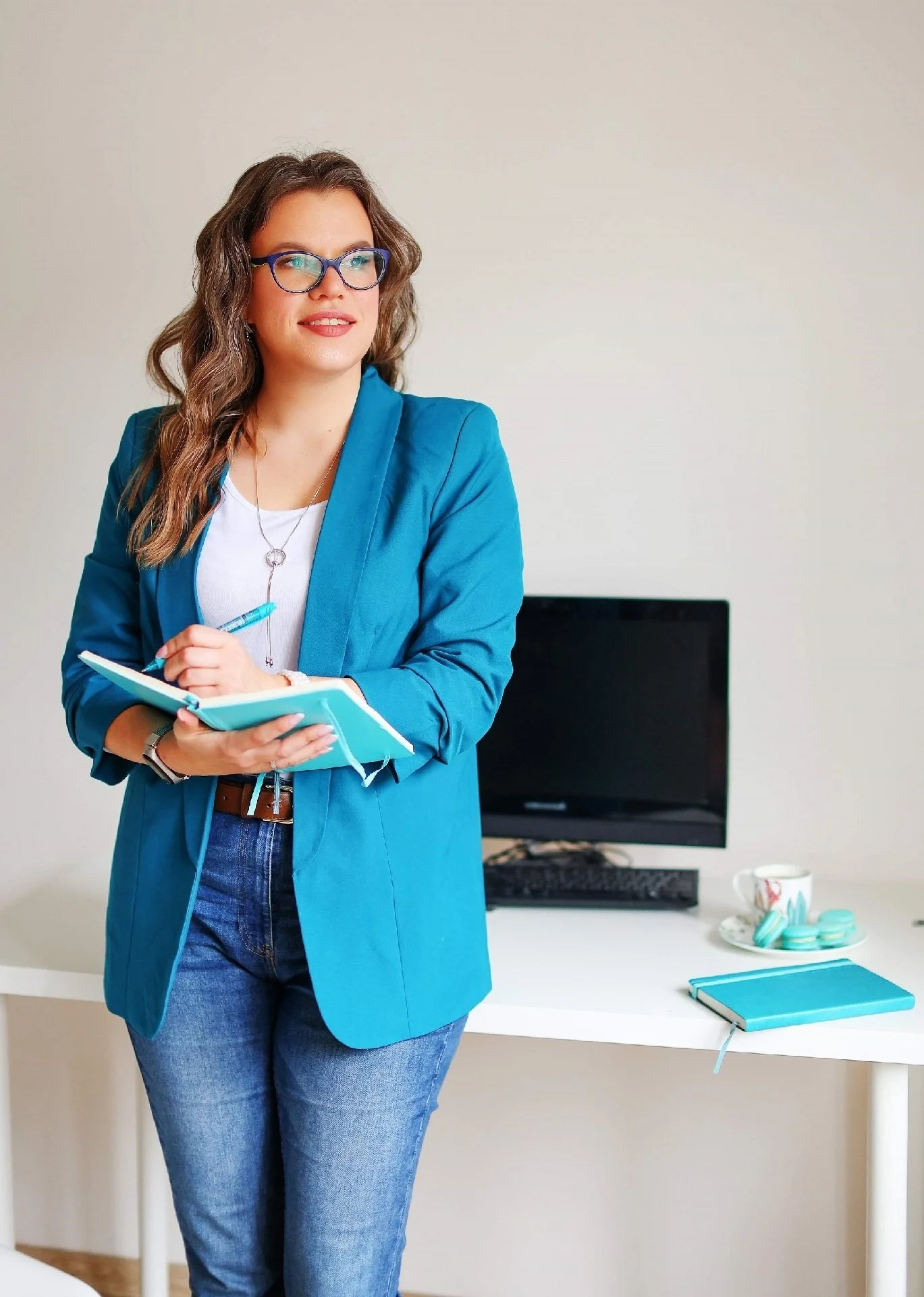 Website designer writing in the notebook | Holistic Visuals