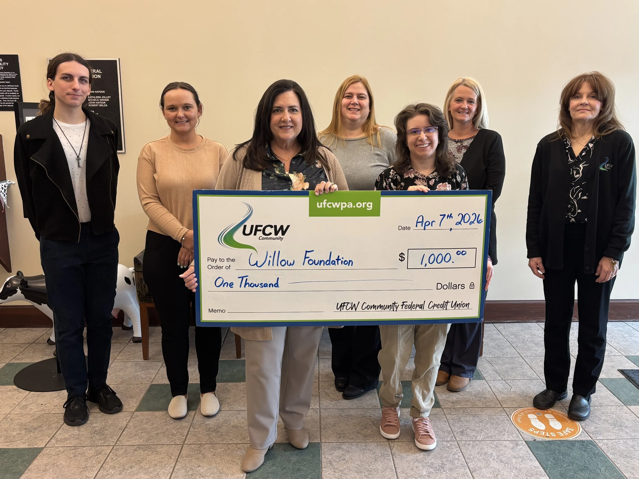 In the photo, left to right (back row) Josiah Carminati, Alexis Knorr, Nina Magyar, Janel Siperko, and Coreen Leonardo. Front row: Kimberly DeAngelo (UFCW Community Federal Credit Union President/CEO) and Sara Pisak (Willow Foundation Community Outre