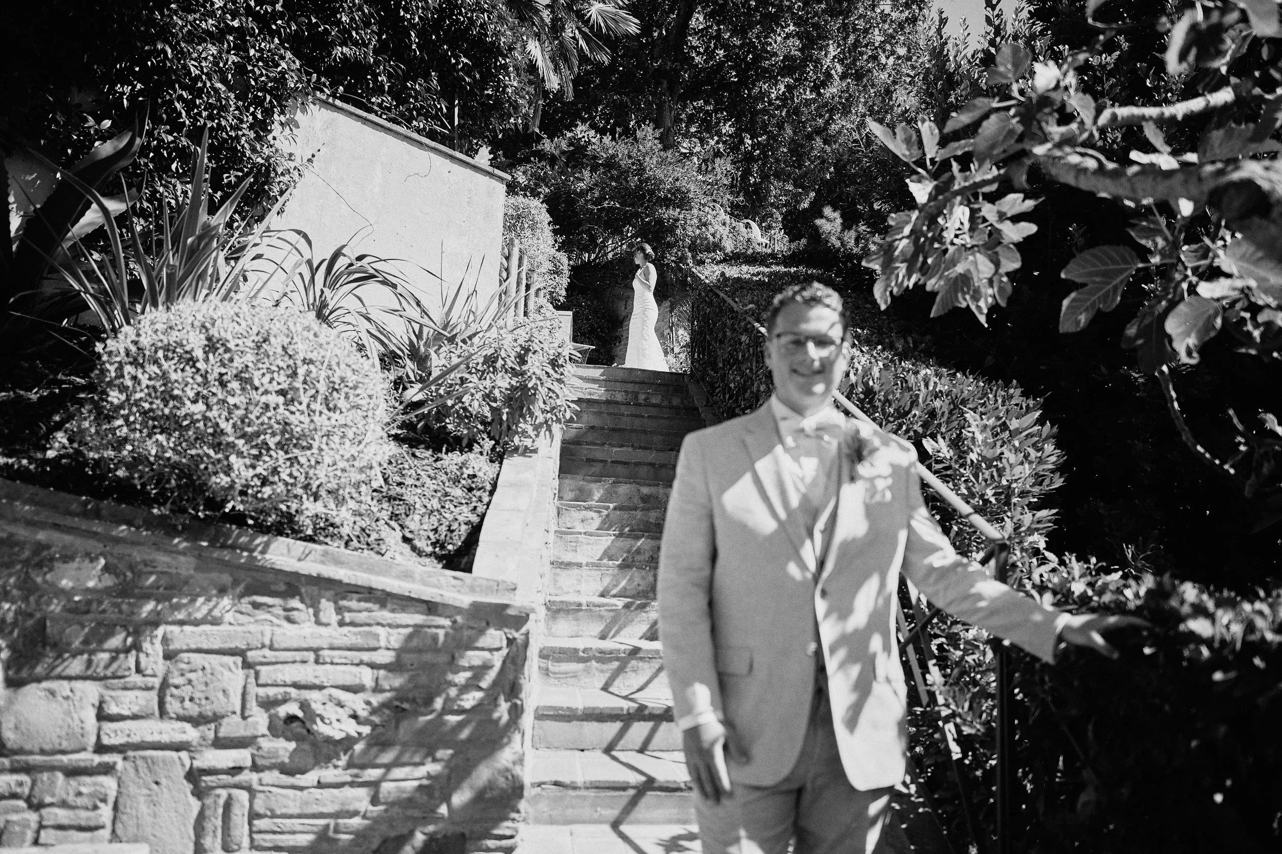Groom preparing for first look in a garden at Borgo Bucciano 