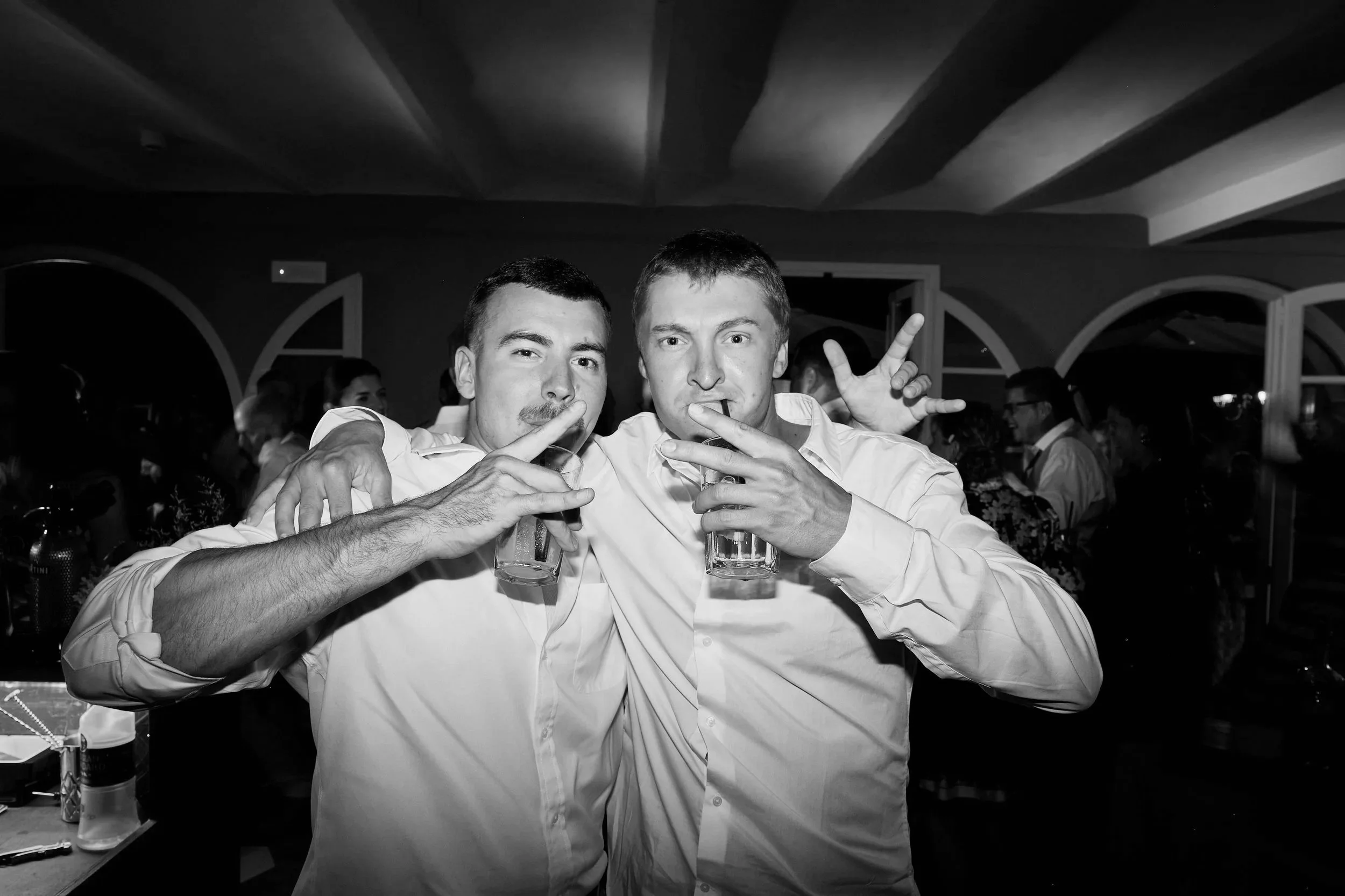 Guests celebrating with drinks on the dance floor