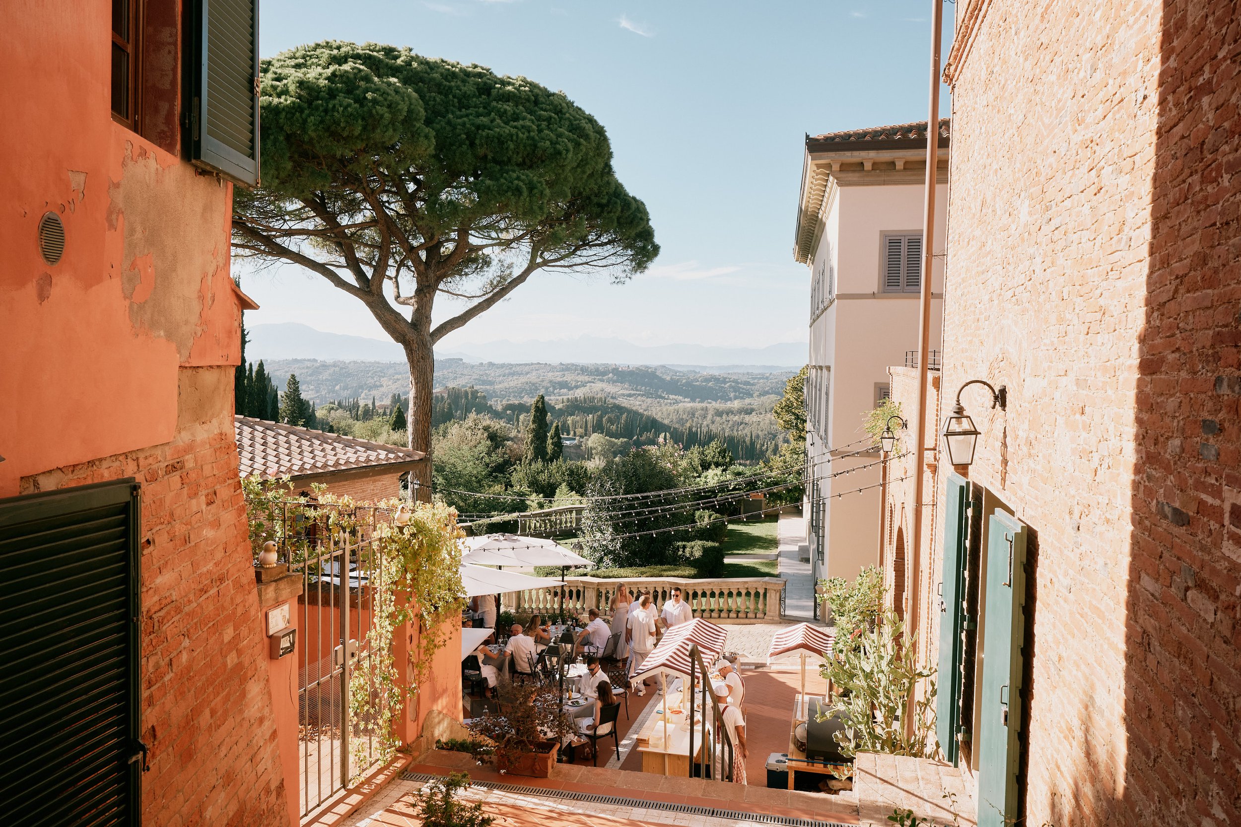 Wedding dinner overlooking Tuscan landscape in Italy