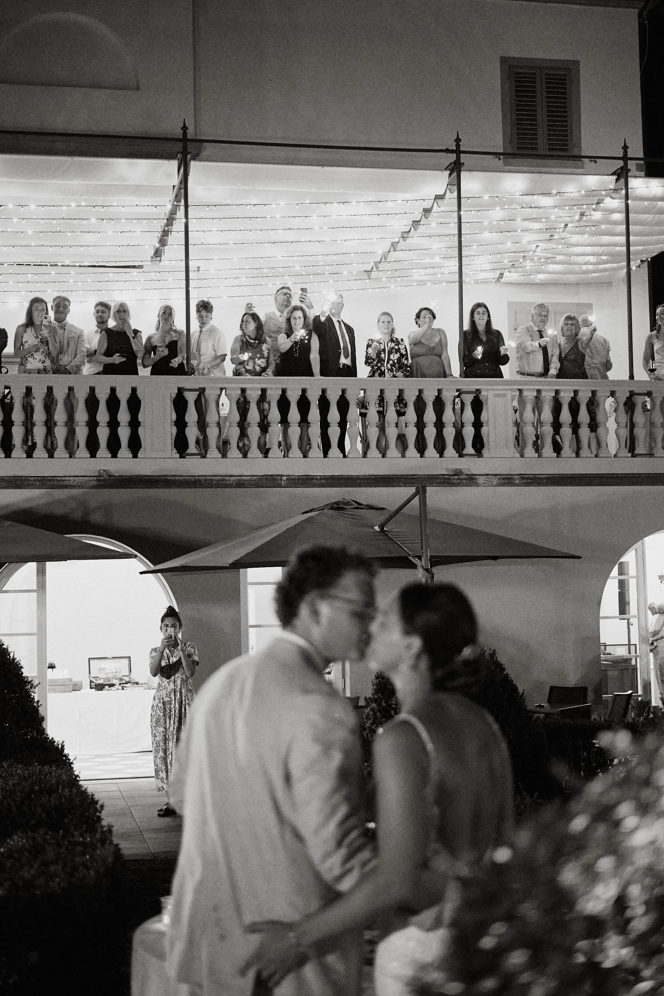 Wedding guests overlooking reception at Tuscan villa
