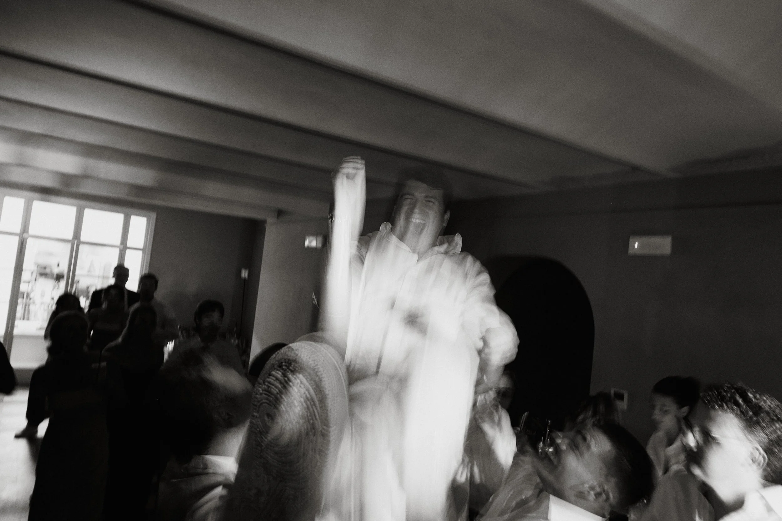 Guests celebrating during wedding reception