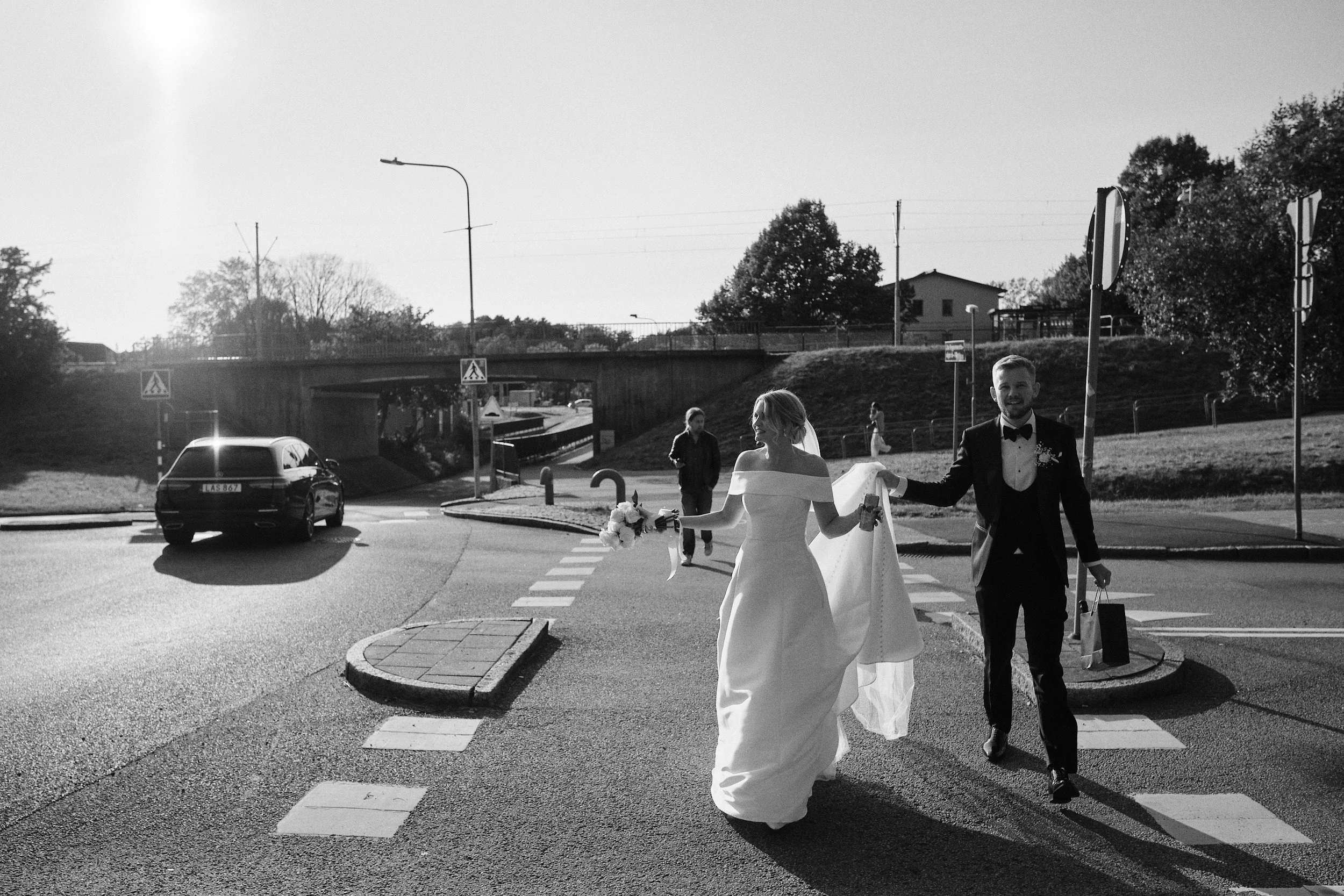 Bride and groom walking in Gothenburg city after ceremony