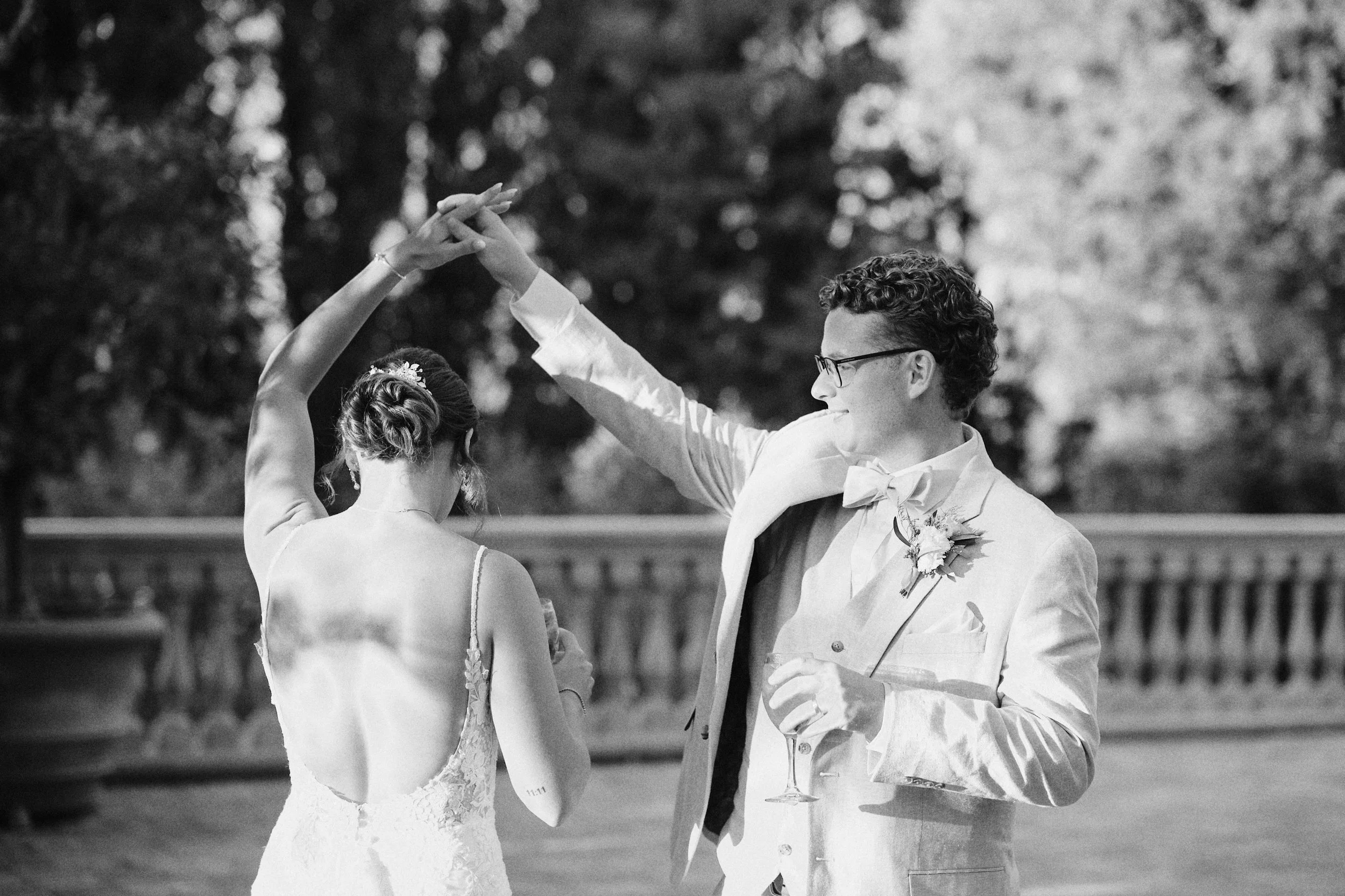 Bride and groom dancing at sunset reception in Italy