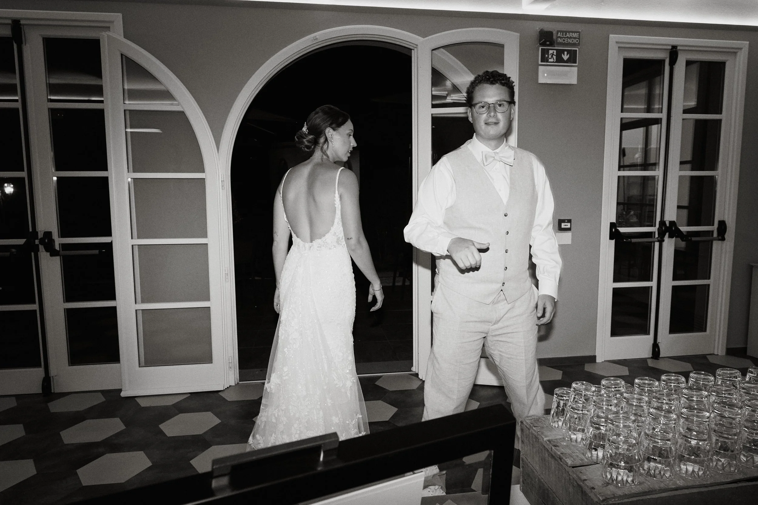 Bride and groom entering evening reception