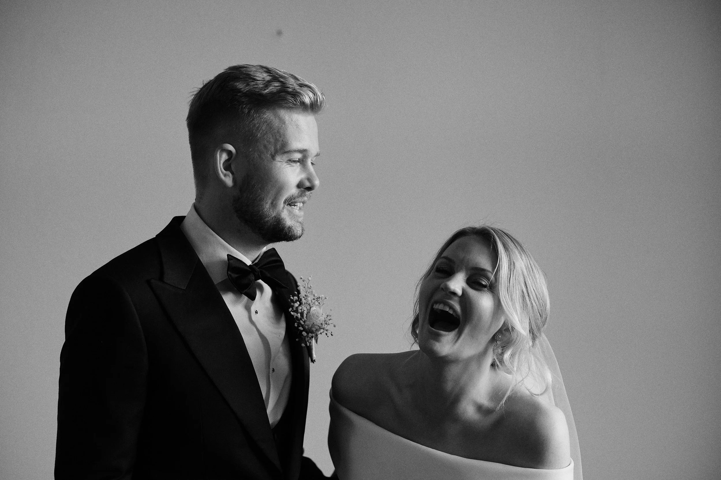 Bride laughing during wedding day in Gothenburg