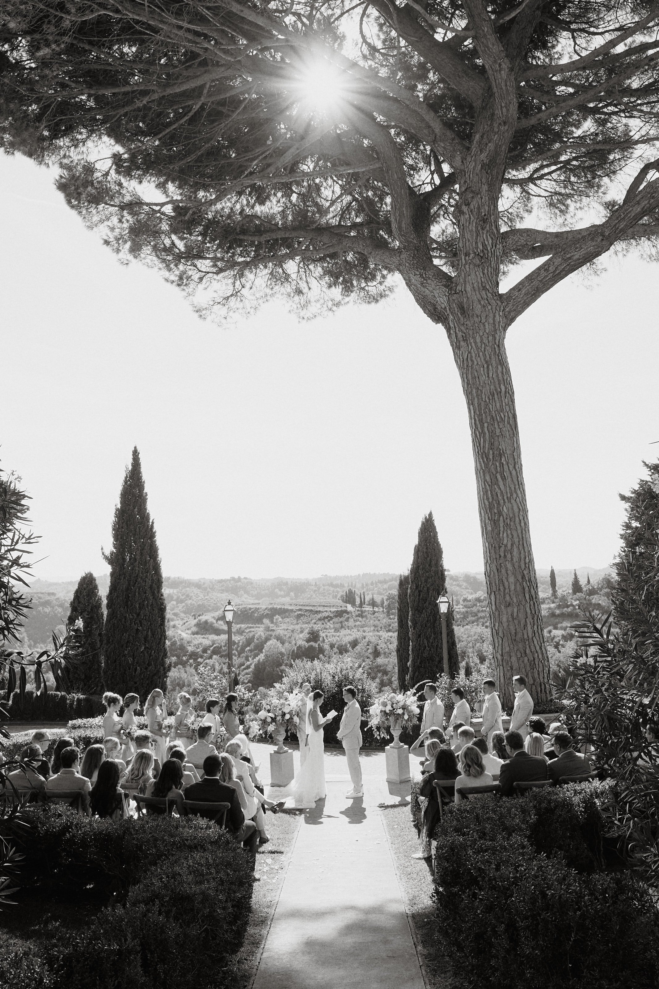 Outdoor wedding ceremony at Borgo Bucciano overlooking the Tuscan landscape