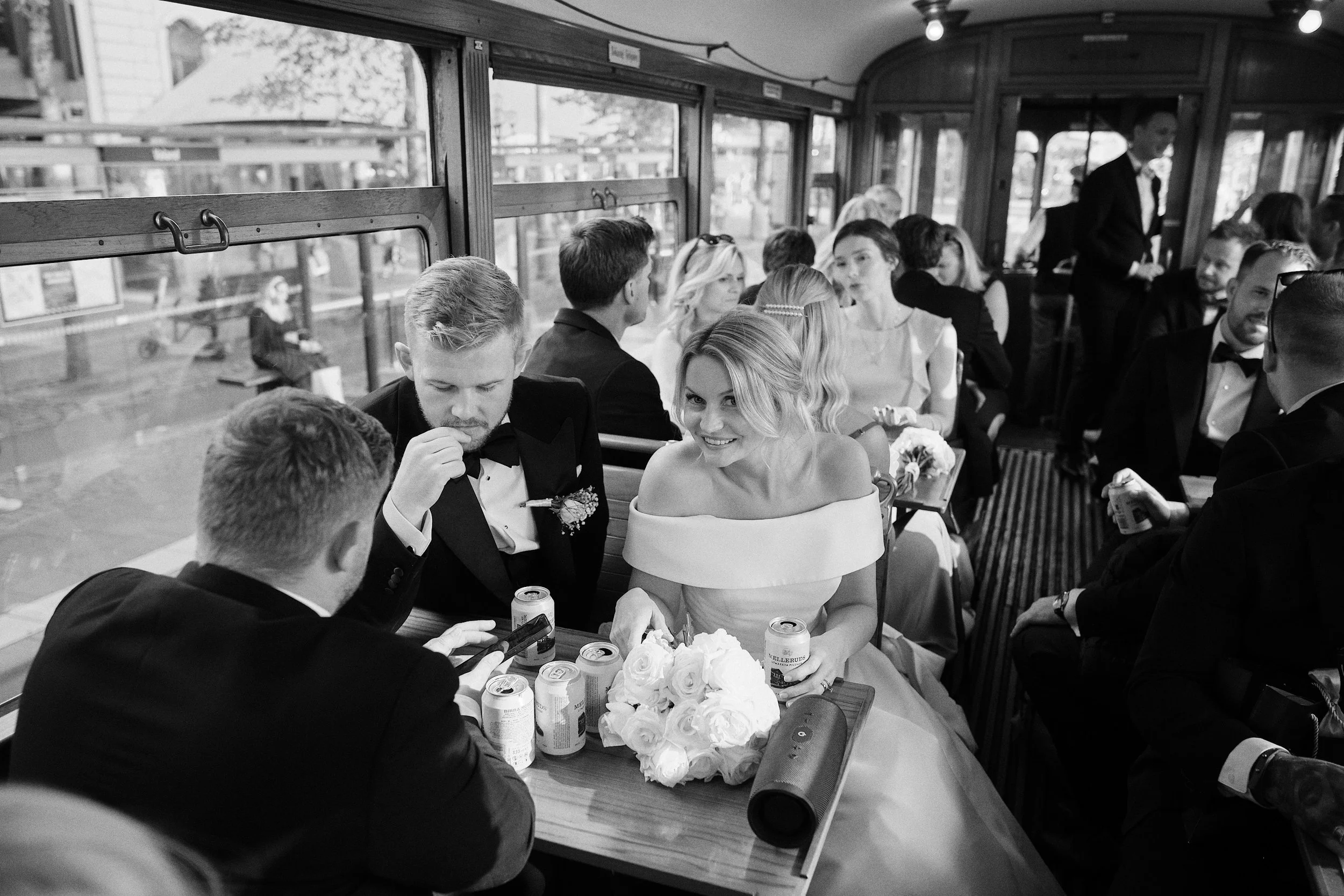 Bride and groom on tram in Gothenburg city wedding