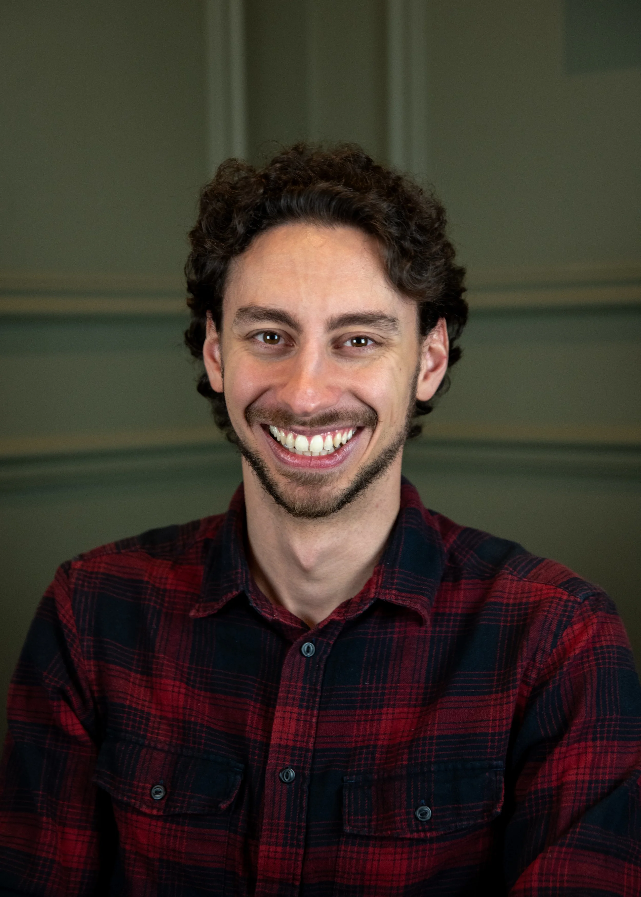 Josh Mortazavi checked shirt smiling