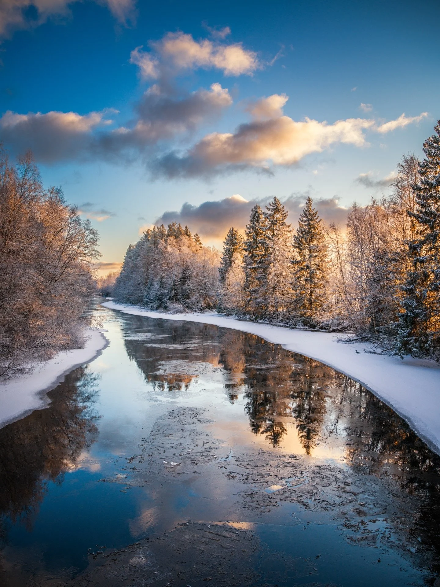 A winter river reflecting the quiet beauty of the Finland 🇫🇮
