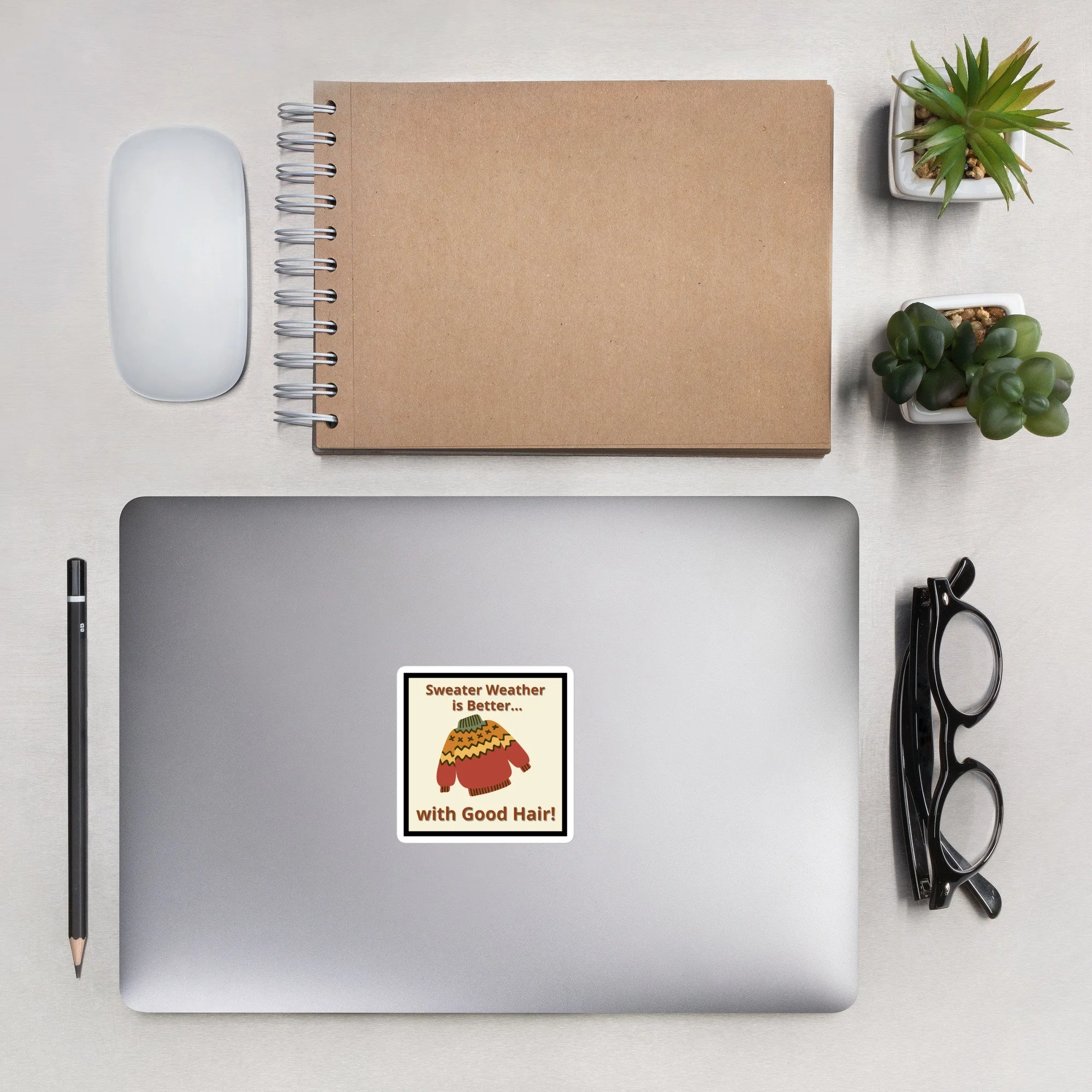 cute fall sticker on the back of a laptop computer that says "sweater weather is better... with good hair"