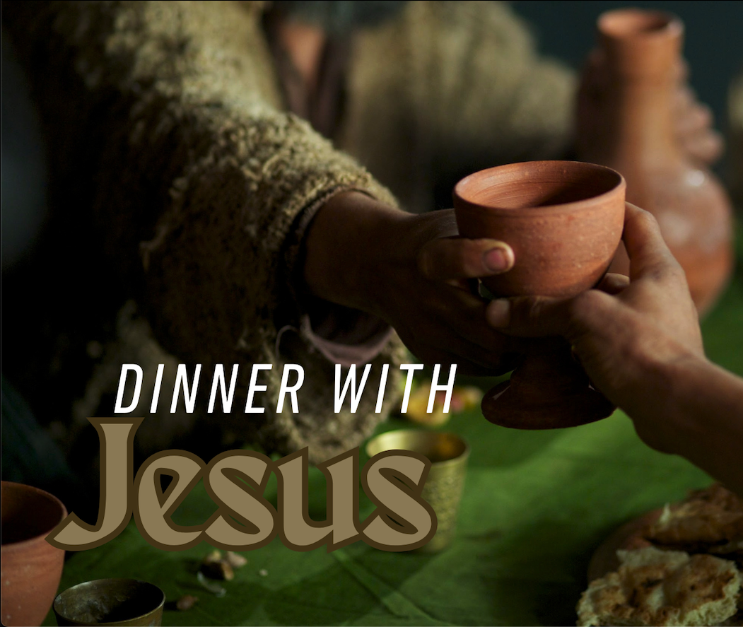 Dinner with Jesus text with a man passing a clay cup to another.