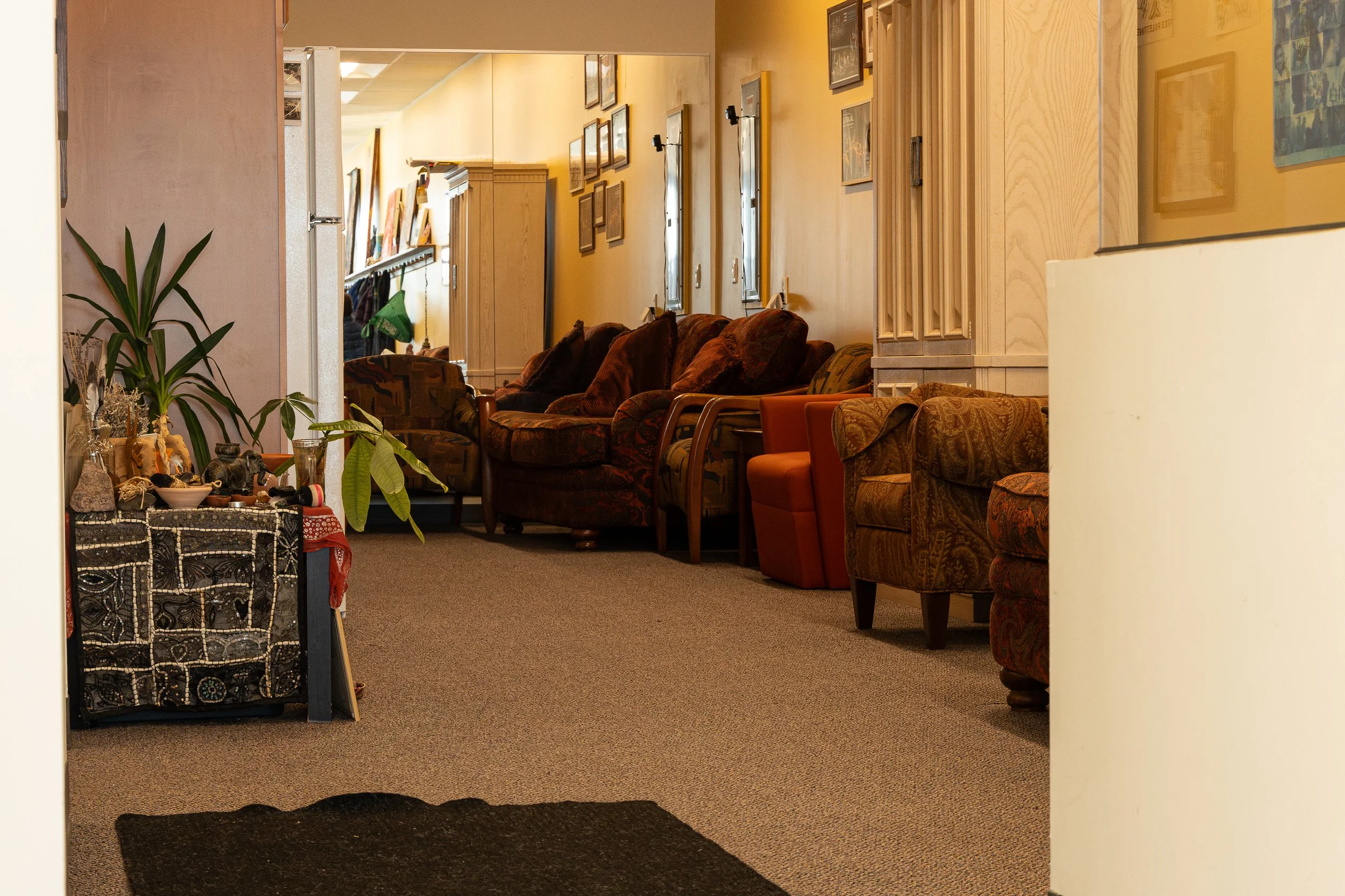 The dancers' lounge. To left is our altar, with offerings from our artists and community members.