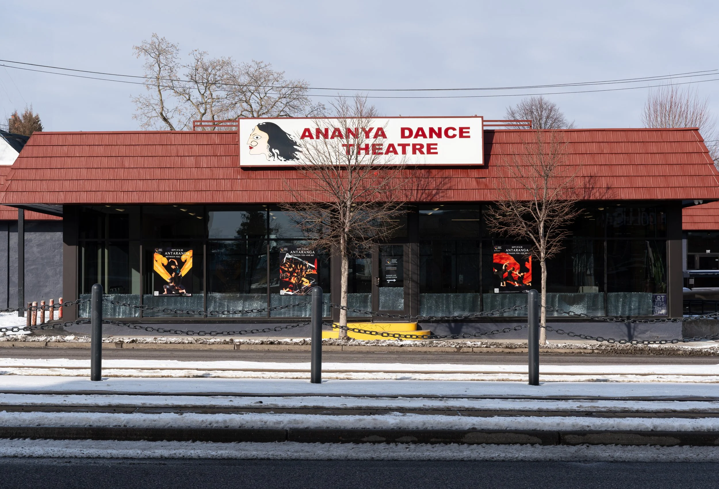 The exterior of the Institute in the daytime. The studio's largest windowed wall faces out toward University Avenue.