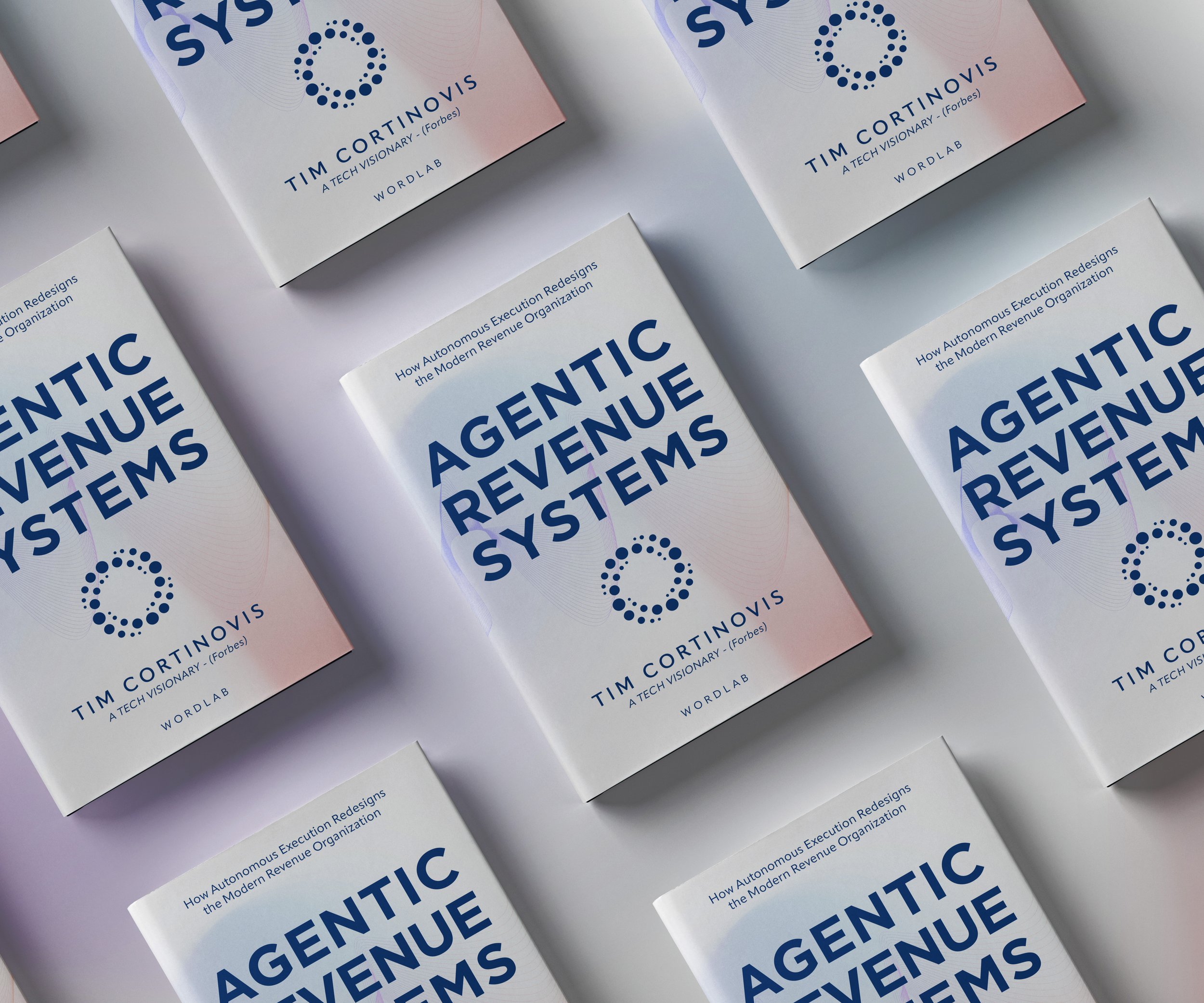 Multiple copies of a book titled 'Agentic Revenue Systems' by Tim Cortinovis arranged on a white surface.